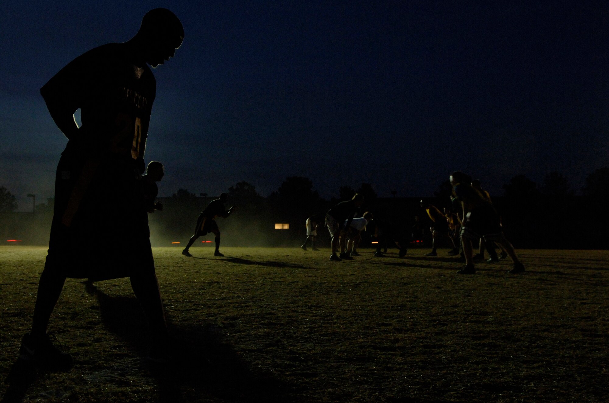 LANGLEY AIR FORCE BASE, Va. -- Leonard Smith of the 1st Security Forces Squadron lines up at wide receiver as he waits for the ball to be hiked during a flag football game against the 1st Equiment Maintenance Squadron Oct.15.  Smith was a key on offense and defense for the 1st SFS team that went on to win the game, 18-12.  (U.S. Air Force photo/Airman 1st Class Vernon Young)