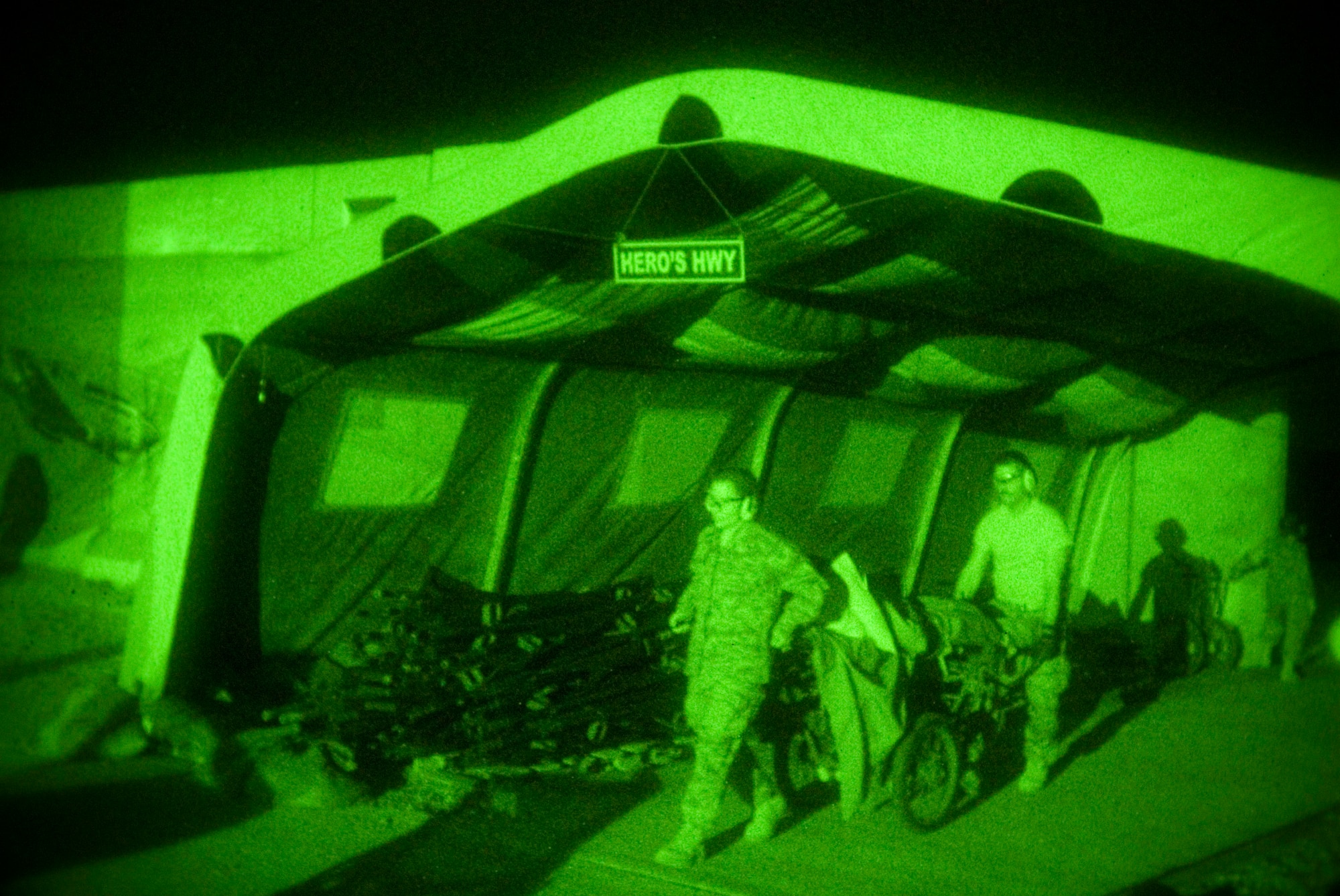 Airman 1st Class Michael Brady is wheeled through "Hero's Highway" en route to the emergency room at the Air Force Theater Hospital in Balad Air Base, Iraq, Oct. 14. Airman Brady was augmenting the Army in an "in-lieu-of" tasking when he was wounded by sniper fire in Ad Diwaniyah, Iraq. Airman Brady is a combat cameraman assigned to the 732nd Air Expeditionary Group. (U.S. Air Force photo/Master Sgt. John Nimmo Sr.) 
