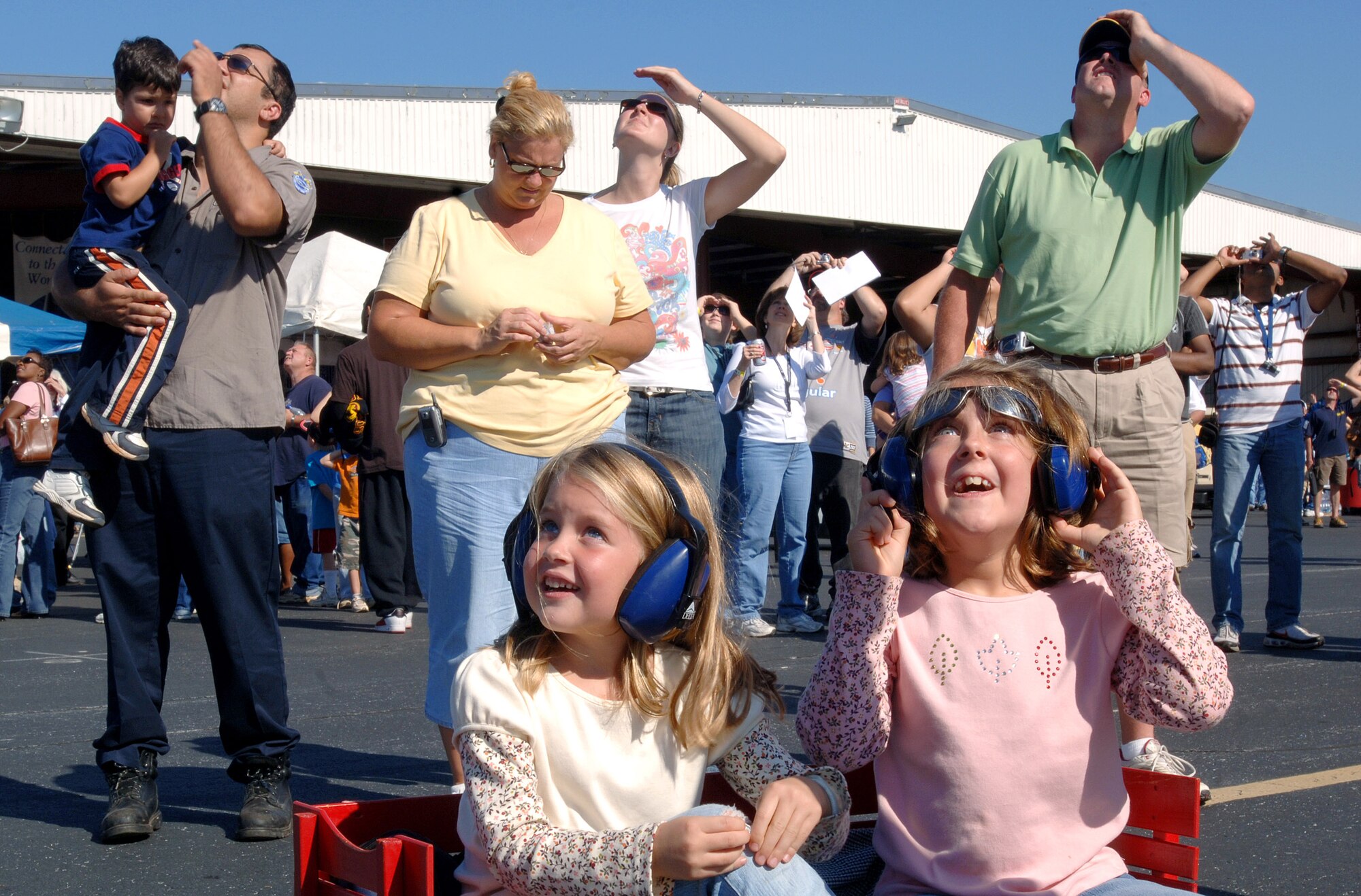 Spectators of the Great Georgia Air Show enjoy aerial demonstrations during Air Force Week Atlanta Oct. 13 at Falcon Field in Peachtree City, Ga. Atlanta is one of six cities throughout the country chosen to host an Air Force Week. The theme for the year is "Heritage to Horizons," celebrating the 60th anniversary of the Air Force, its history and the future of the world's greatest force in air and space. (U.S. Air Force photo/Staff Sgt. Bennie J. Davis III)