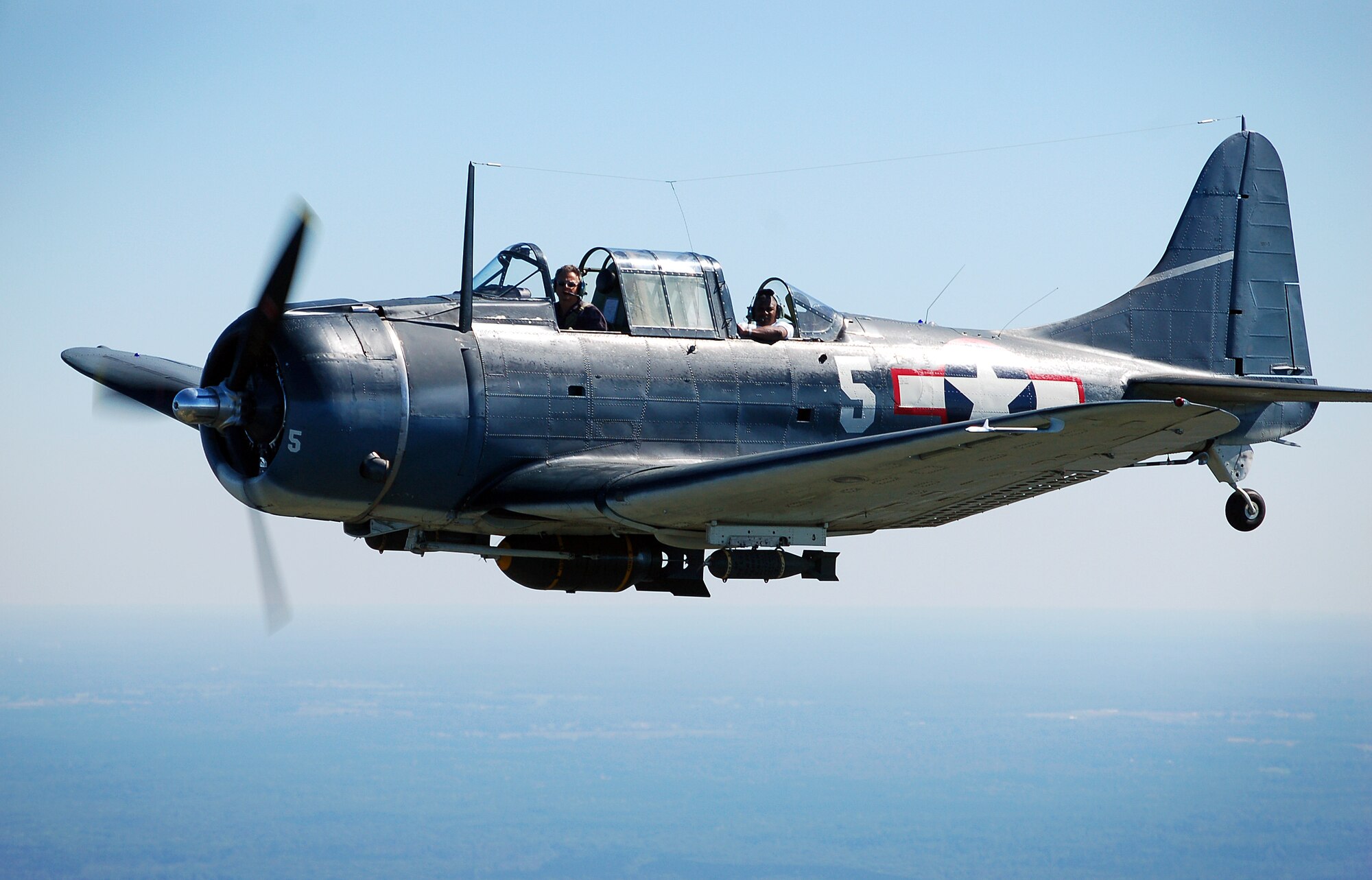 A vintage World War II aircraft, the SBD Dauntless, flies over Falcon Field during the Great Georgia Air Show as part of Air Force Week Atlanta Oct. 12 over Peachtree City, Ga. (U.S. Air Force photo/Tech. Sgt. Ben Gonzales)