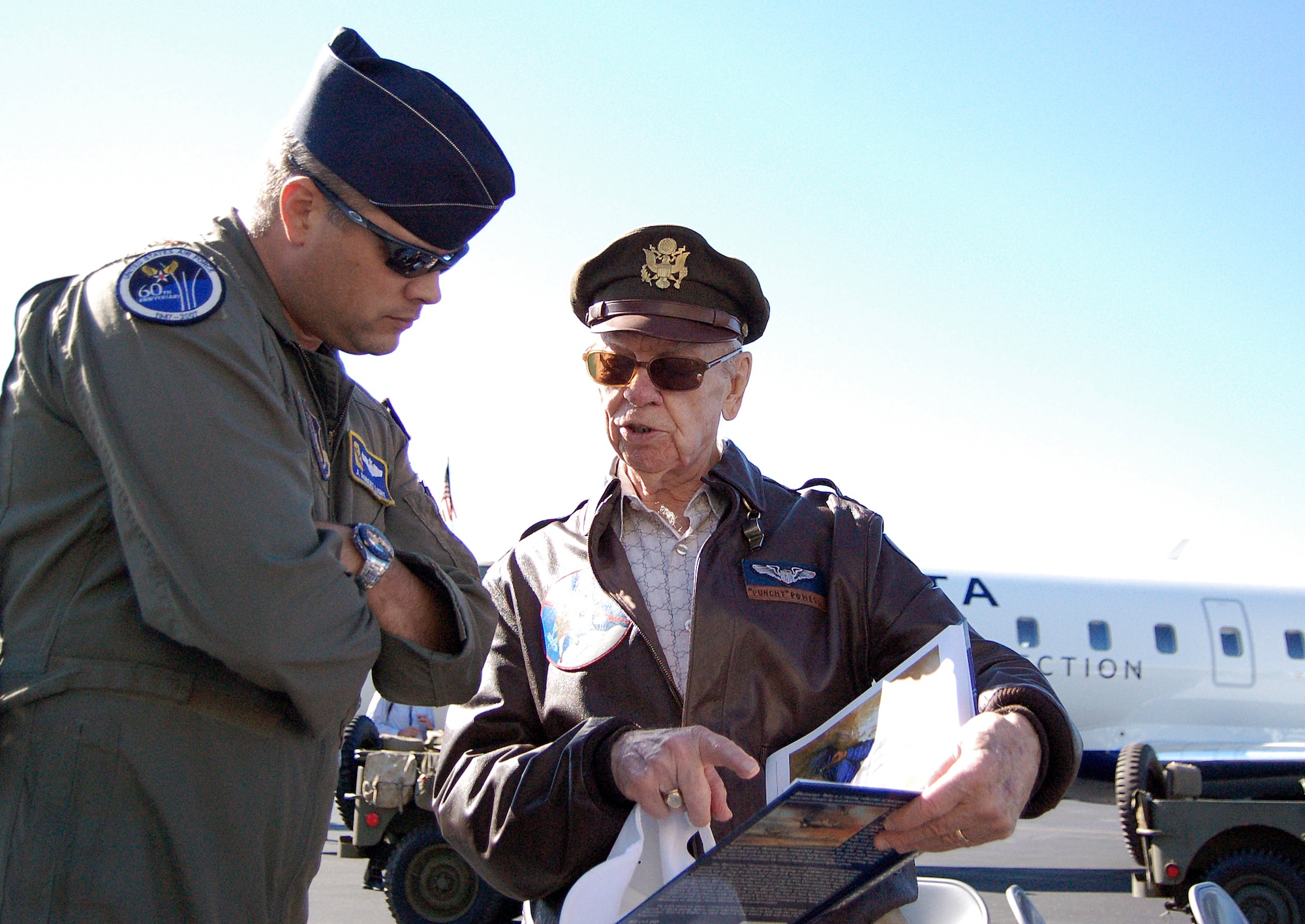 World War II pilot Bob Powell talks about his book with participants of the Great Georgia Air Show during Air Force Week Atlanta Oct. 12 at Falcon Field in Peachtree City, Ga. Mr. Powell flew the P-51 Mustang during the war and is credited with two confirmed kills. He has since wrote two books about his military career. (U.S. Air Force photo/Tech. Sgt. Ben Gonzales)  