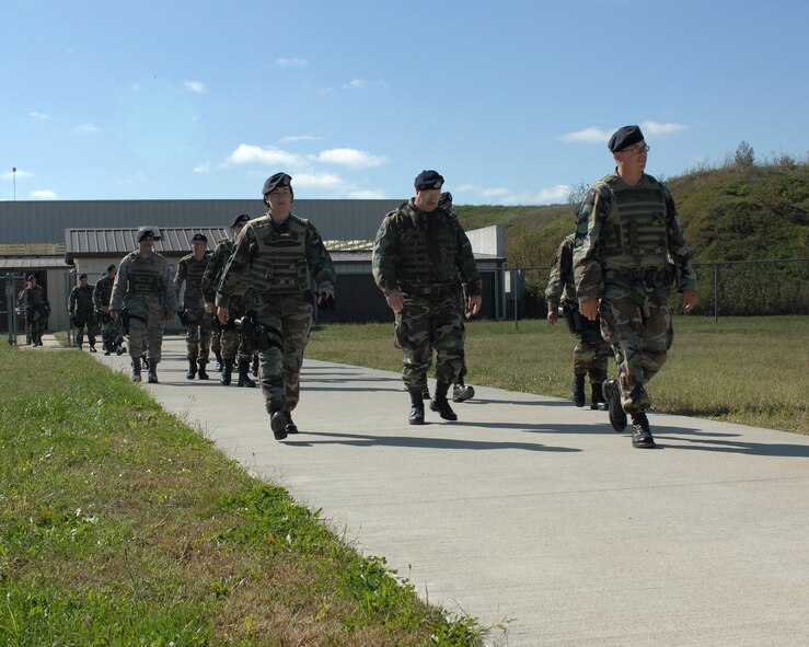 WHITEMAN AIR FORCE BASE, Mo. - Members of the 509th Security Forces Squadron return from qualifying at the firing range after a morning of M9 pistol training Oct. 11. (U.S. Air Force photo/Staff Sgt. Charles D. Larkin Sr.)         