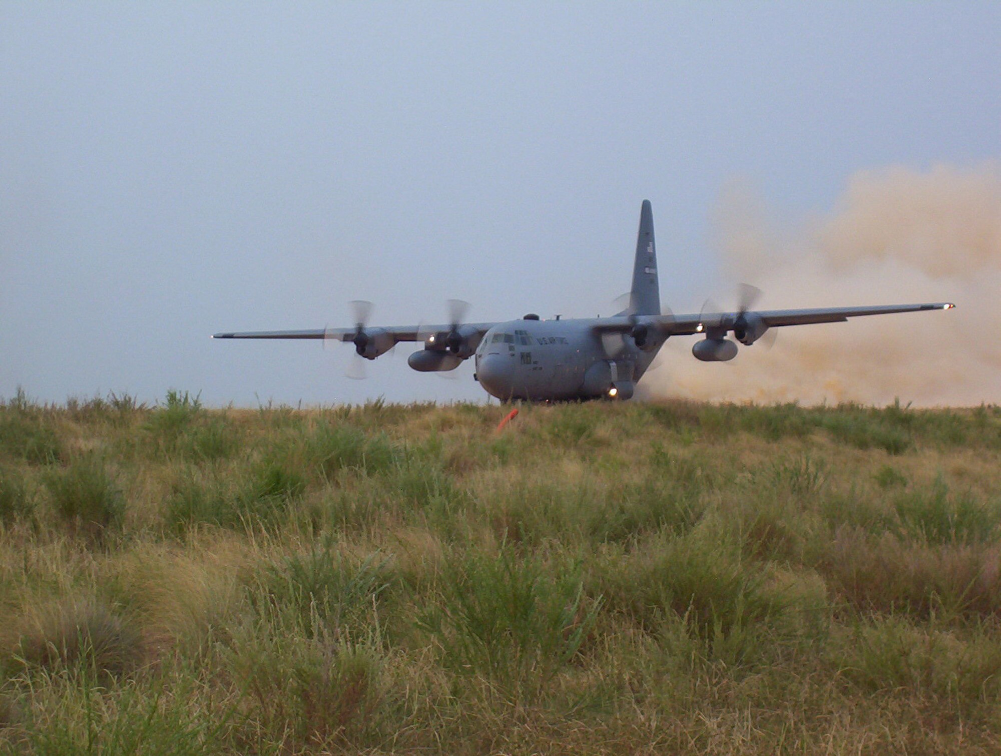 A 440th Airlift Wing C-130 takes off from a dirt runway at the Holland Drop Zone on Fort Bragg, N.C. The airplane and crew took part in the wing's first tactical mission after their unit moved from Gen. Mitchell International Airport Air Reserve Station in Milwaukee to Pope Air Force Base, N.C. The mission was a two-ship, engines running, on and off-load exercise, with Pope's Regular Air Force 43rd Aeromedical Evacuation Squadron. (U.S. Air Force photo)