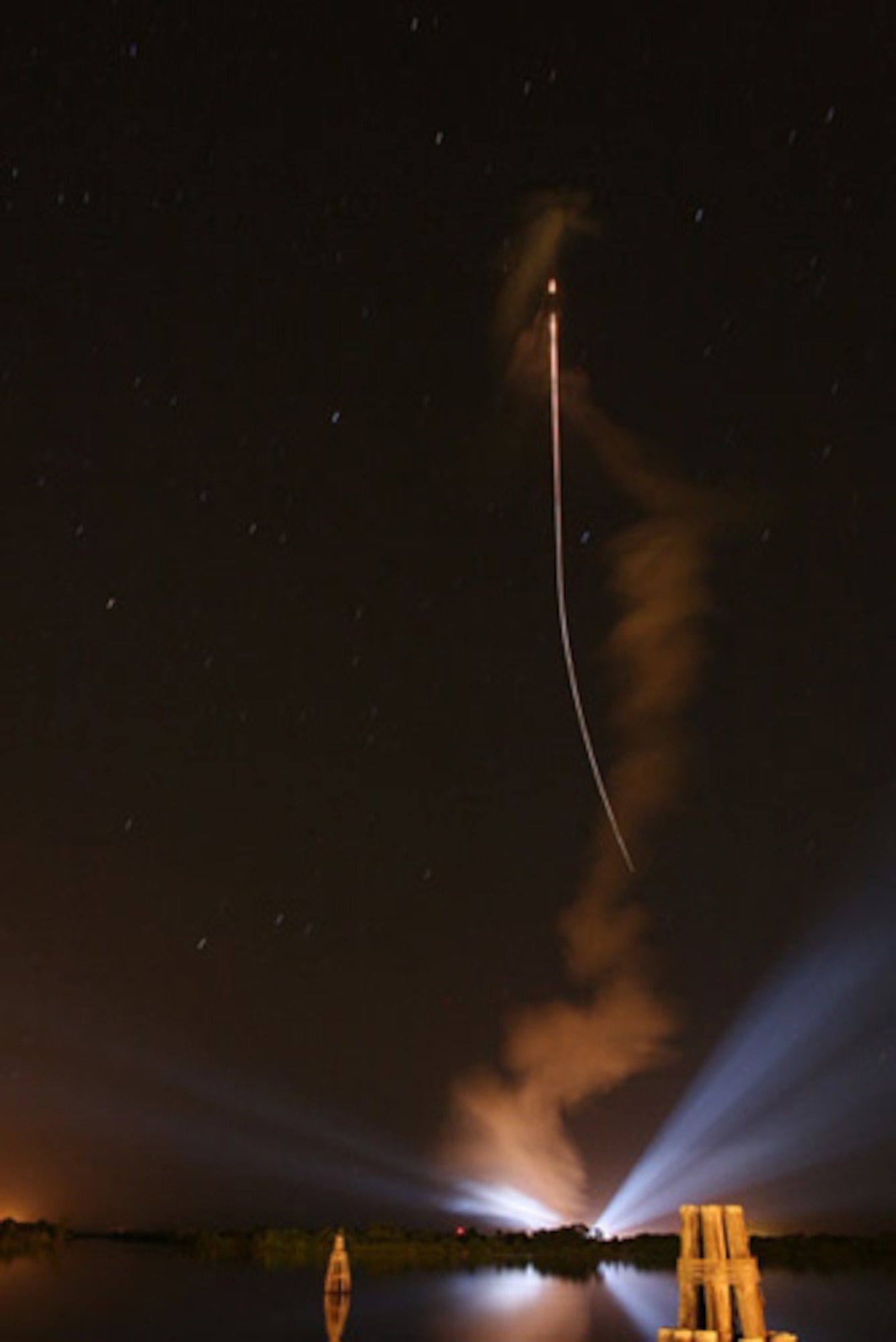 An Atlas V rocket carrying the first Wideband Global Satellite streaks into the Central Florida evening sky after liftoff from Space Launch Complex 41, Oct. 10. This first WGS satellite will provide more communications capability for the military than the entire Defense Satellite Communications System satellite constellation currently on orbit. (Photo by Chris Miller, Spaceflight Now.com)