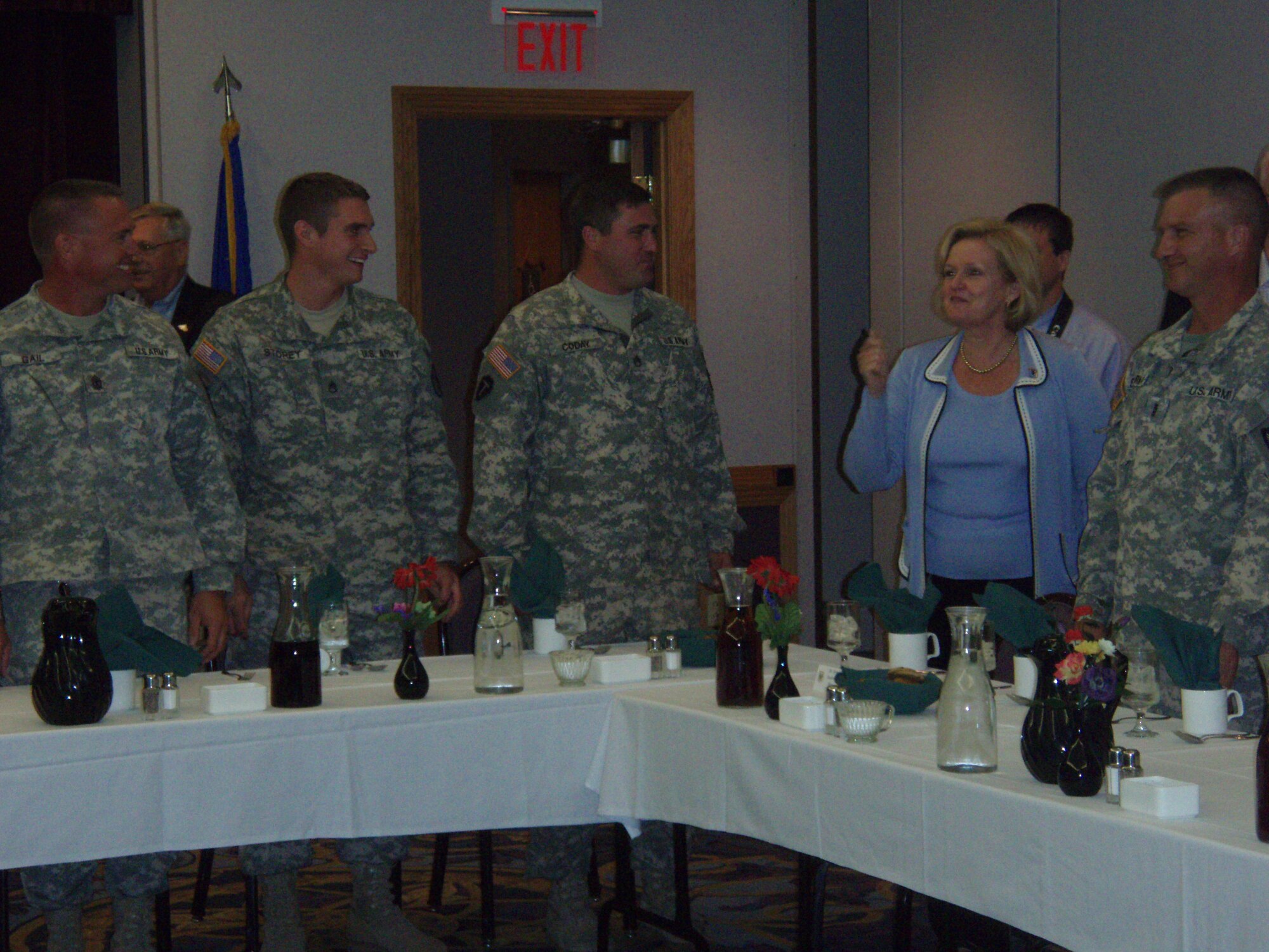 Missouri National Guard members of the 1-135th Attack Reconnaissance Battalion talk with Sen. Claire McCaskill, D-Mo., at a luncheon during her recent visit to Whiteman Air Force Base. (Photo printed with permission of Bethany Buckingham)