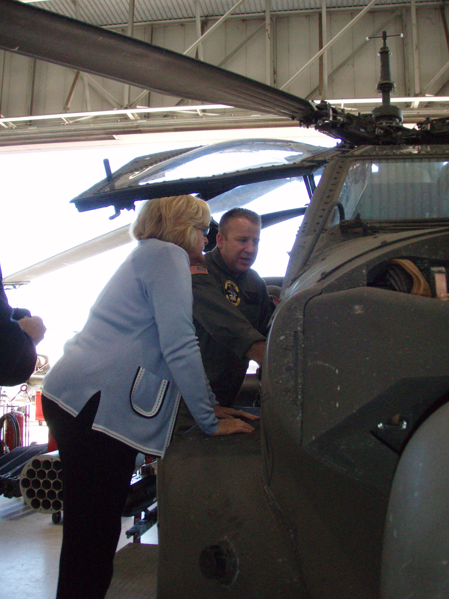 Lt. Col. Thomas Burson, Missouri National Guard 1-135th Attack Reconnaissance Battalion commander,  explains the AH-64 Apache helicopter to Sen. Claire McCaskill, D-Mo., during her recent visit to Whiteman Air Force Base. (Photo printed with permission of Bethany Buckingham)