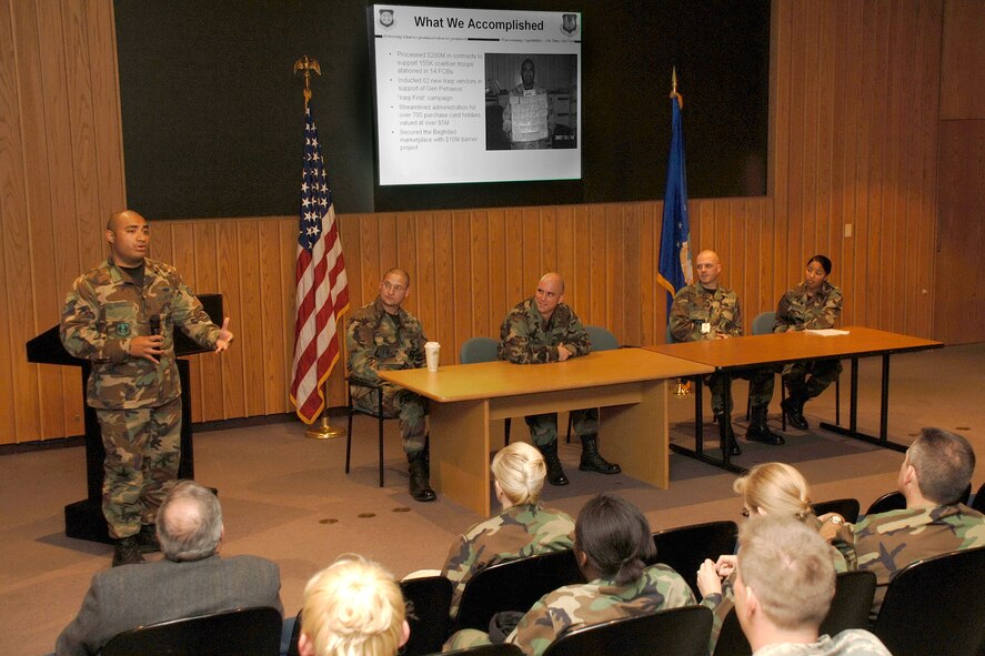 Staff Sgt. Patrick Raass of the 653rd Electronic Systems Wing (standing) discusses his recent deployment with senior leaders and other members of the Hanscom community Oct.11 in the O’Neill Auditorium. The other presenters, also all recently returned deployers from the 653rd, include ,from left, Capt. Gabriel Montalvo, Capt. Steven Piche, Capt. Raymond Erickson and Airman 1st Class Meghan Williamson. (U.S. Air Force photo by Jan Abate.)