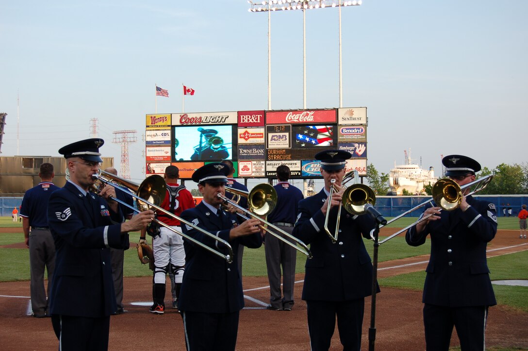 (L-R) Cirrus Trombone Quartet members Staff Sergeant Jason Foster, Technical Sergeant Kieth Fitzgerald, Staff Sergeant Mike Harkins and Technical Sergeant John Cisar of the USAF Heritage of America Band perform the national anthem for a Norfolk Tides home game.