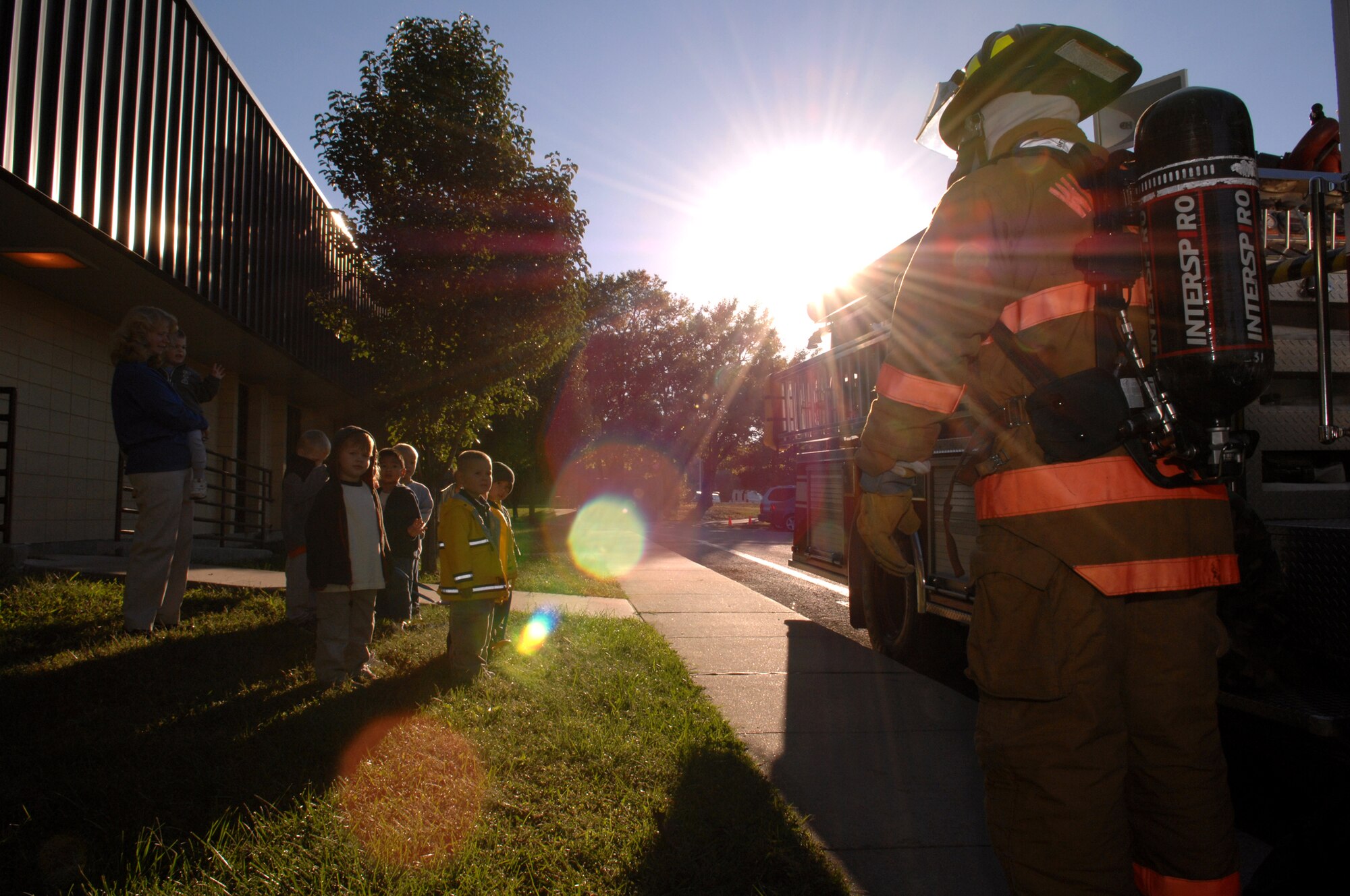 Whiteman Air Force Base, Mo. -- Senior Airman Larry Hendricks, 509th Civil Engineer Squadron, teaches children about fire safety as part of Fire Prevention Week Oct. 10.  (U.S. Air Force photo/Airman 1st Class Stephanie Clark) 