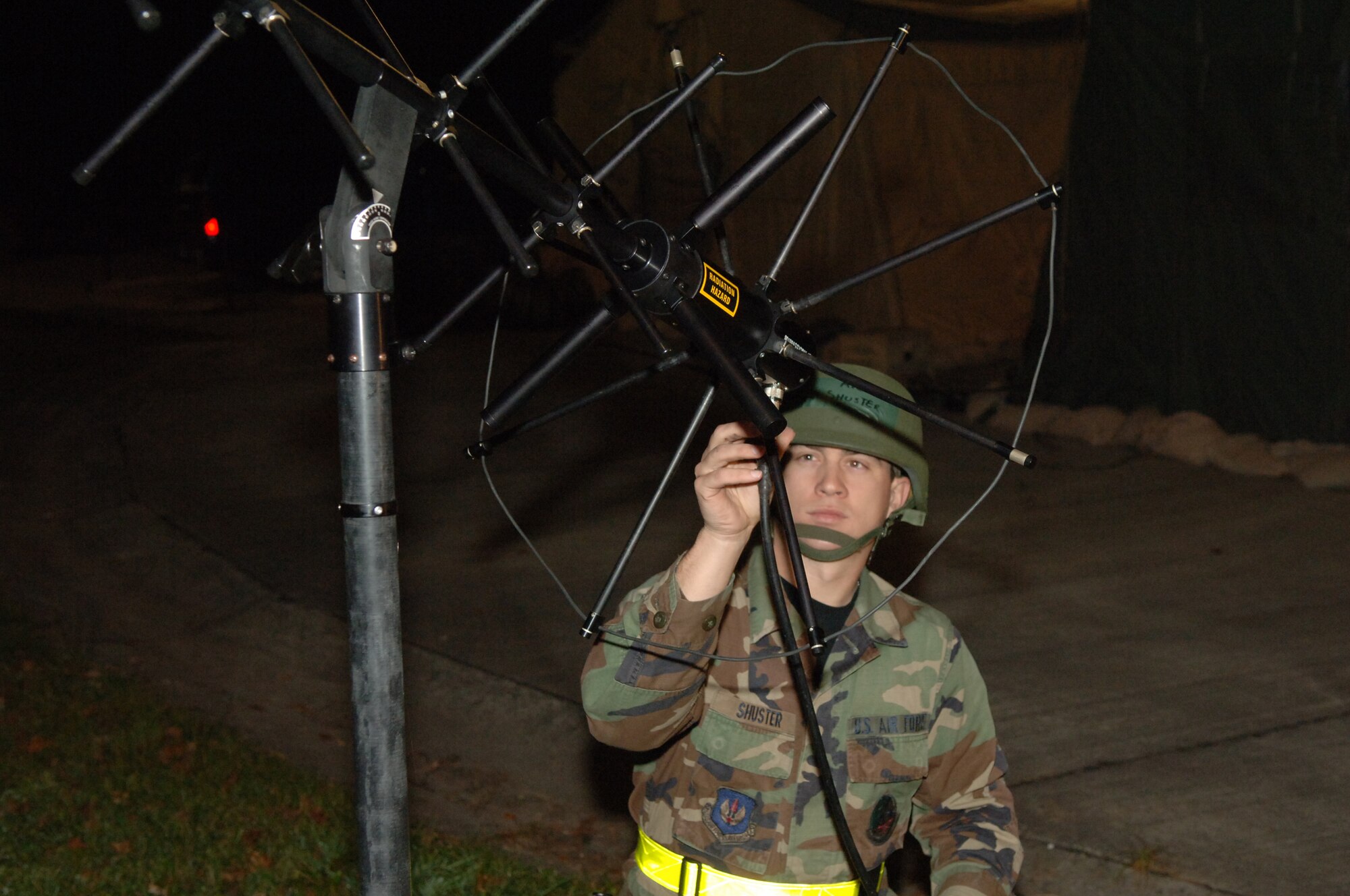 Airman 1st Class John Shuster, 1st Combat Communications Squadron, sets up the tactical satellite during the Operational Readiness Exercise at the field training site on Ramstein Air Base, Germany, Oct. 15. The exercise is designed to test the ability of Airmen to survive in austere environments with chemical, biological, radiological, nuclear and explosive hazards.  (U.S. Air Force Photo by Airman 1st Class Kelly LeGuillon) 