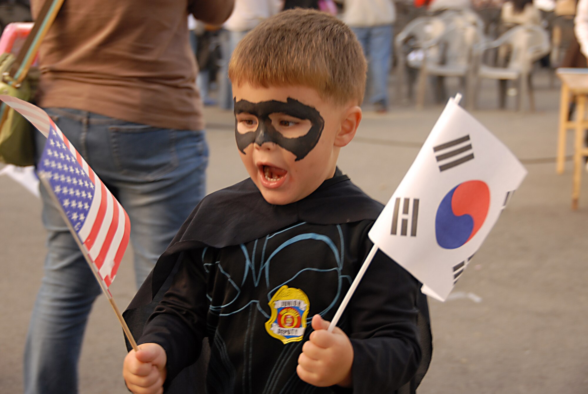 OSAN AIR BASE, Republic of Korea -- Jacob Reese, the 4-year-old son of LtCol Gregory Reese, 51SFS Commander,  excitedly waves both a Korean and American flag during the Korean/American Friendship Festival on Oct. 15, 2007 (U.S. Air Force photo by Staff Sgt. Ronnie Hill) (Released)