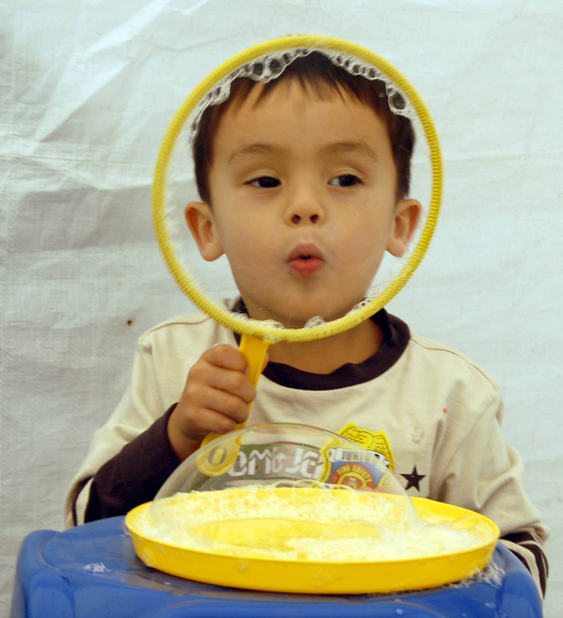 OSAN AIR BASE, Republic of Korea -- Andrew Wheeler, the 3-year-old son of 1Lt Richard Wheeler, 7AF, blows bubbles during the Korean/American Friendship Festival on Oct. 15, 2007 (U.S. Air Force photo by Staff Sgt. Ronnie Hill) (Released)