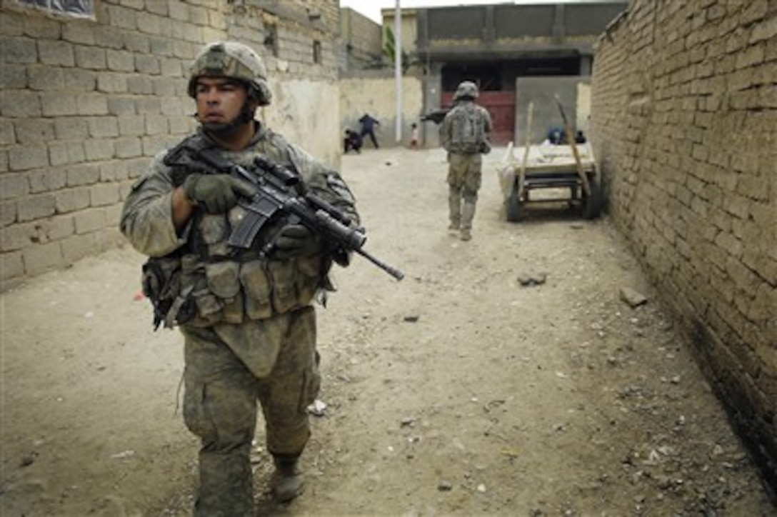 U.S. Army Staff Sgt. Julian Jimenez provides security during combat operations in Balure, Iraq, on Oct. 5, 2007.  Jimenez is assigned to Bravo Company, 6th Battalion, 9th Cavalry Regiment, 3rd Brigade Combat Team, 3rd Cavalry Division.  