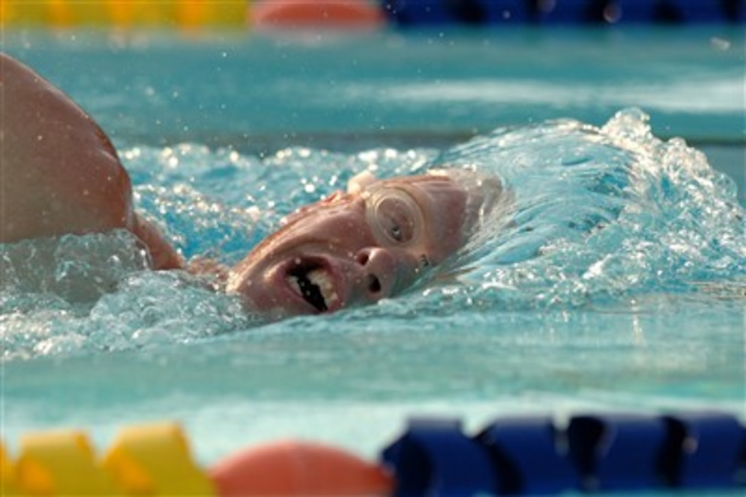 U.S. Air Force Tech. Sgt. Michael Bergquist, a triathlete from Geiger Air National Guard Base swims practice laps at a pool to get ready for the triathlon he will compete in later in the week in Mumbai, India, on Oct. 13, 2007.  Bergquist will be competing in the Counceil International du Sport Militarie's Military World Games.  