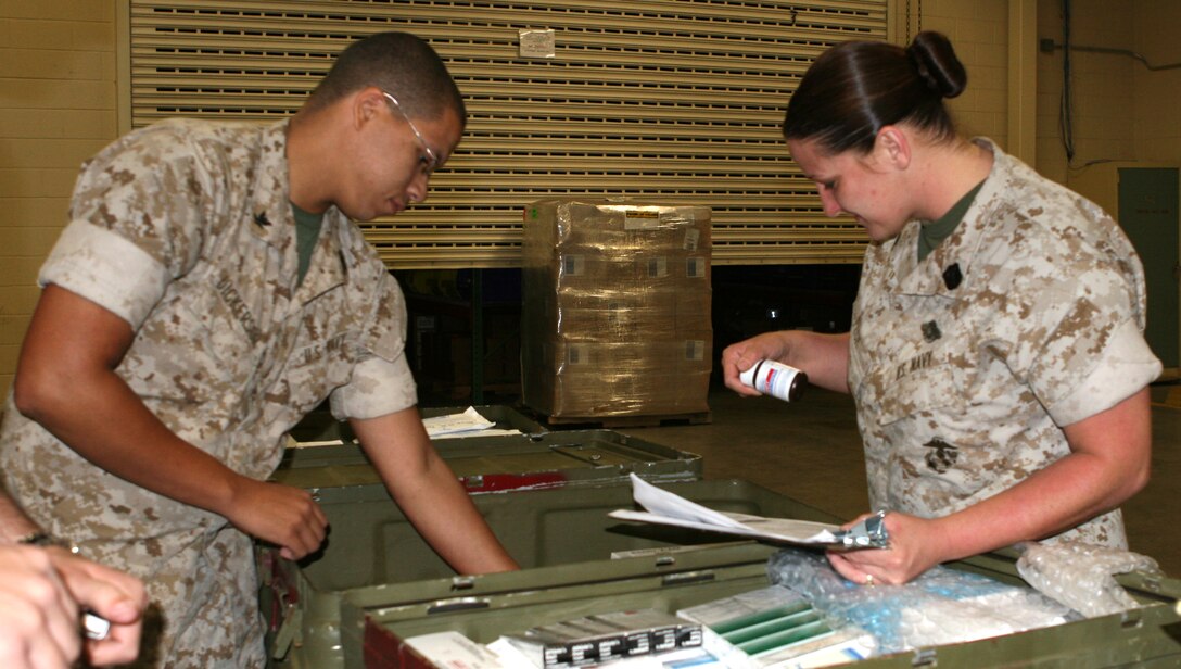 Sailors check expiration dates on medication bottles before adding them to medical supply blocks.  MEDLOG ensures that all blocks have updated supplies for the medical care of deployed troops.  These sailors are with 2nd Medical Logistics Company, 2nd Supply Battalion, Combat Logistics Regiment 27, 2nd Marine Logistics Group.