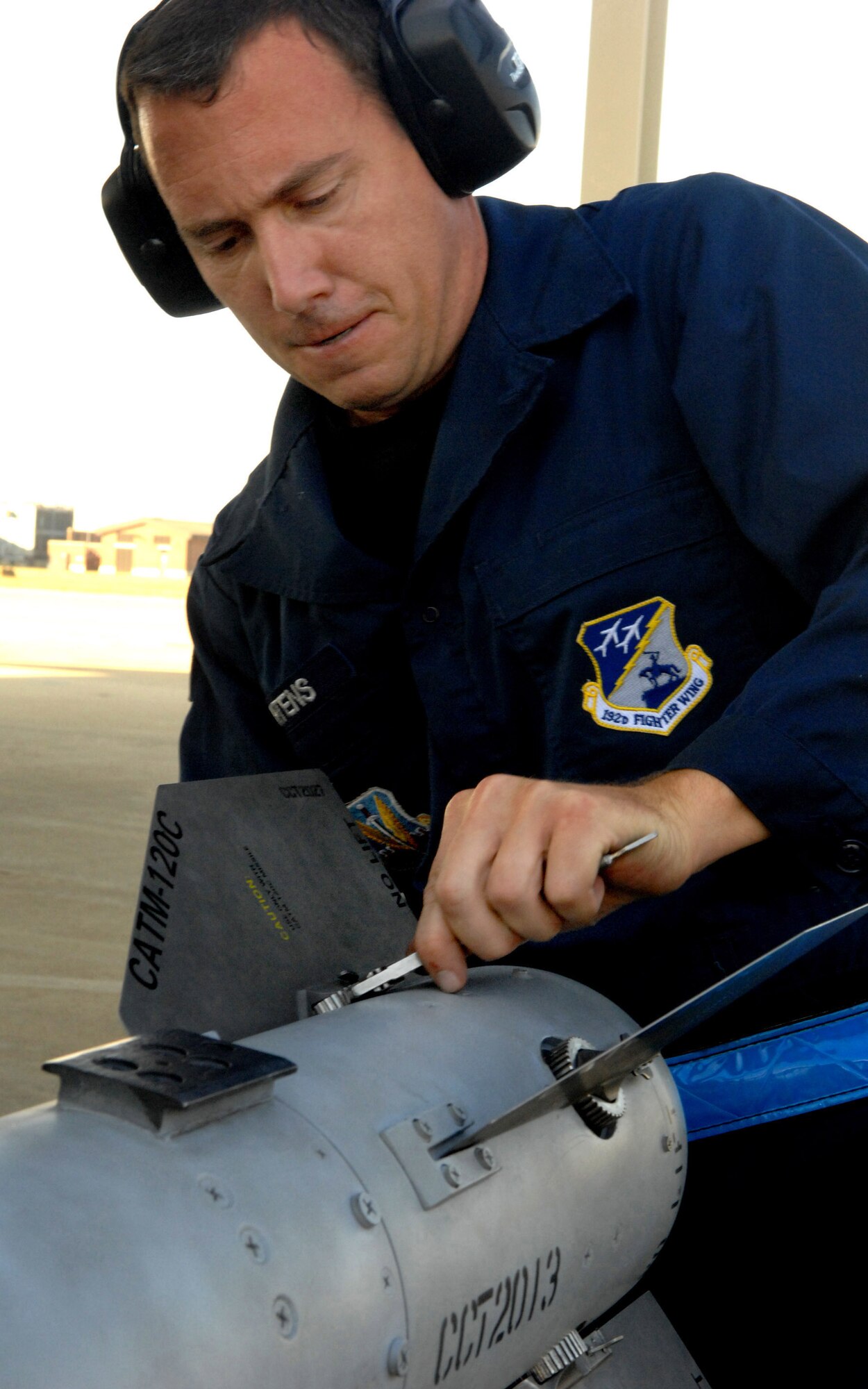 Tech. Sgt. David Martens performs an AIM-120 missile wing and fin preparation, during a weapons crew load competition at the 94th Fighter Squadron Oct. 17. This preparation is done to ensure the wings and fins are undamaged prior to installation on the missile. Sergeant Martens is one of the crew members from the Air National Guard’s 192nd Fighter Wing working out of the 94th Aircraft Maintenance Unit. The 27th and 71st AMUs will perform similar competitions and earn points based on the fastest and safest crew. After each crew competes, scores are tallied and a winning crew will be announced. Competitions are performed on a quarterly basis, and these winners will compete for the Load Crew of the Year. (U.S. Air Force photo/Senior Airman Cecil C. McCloud)