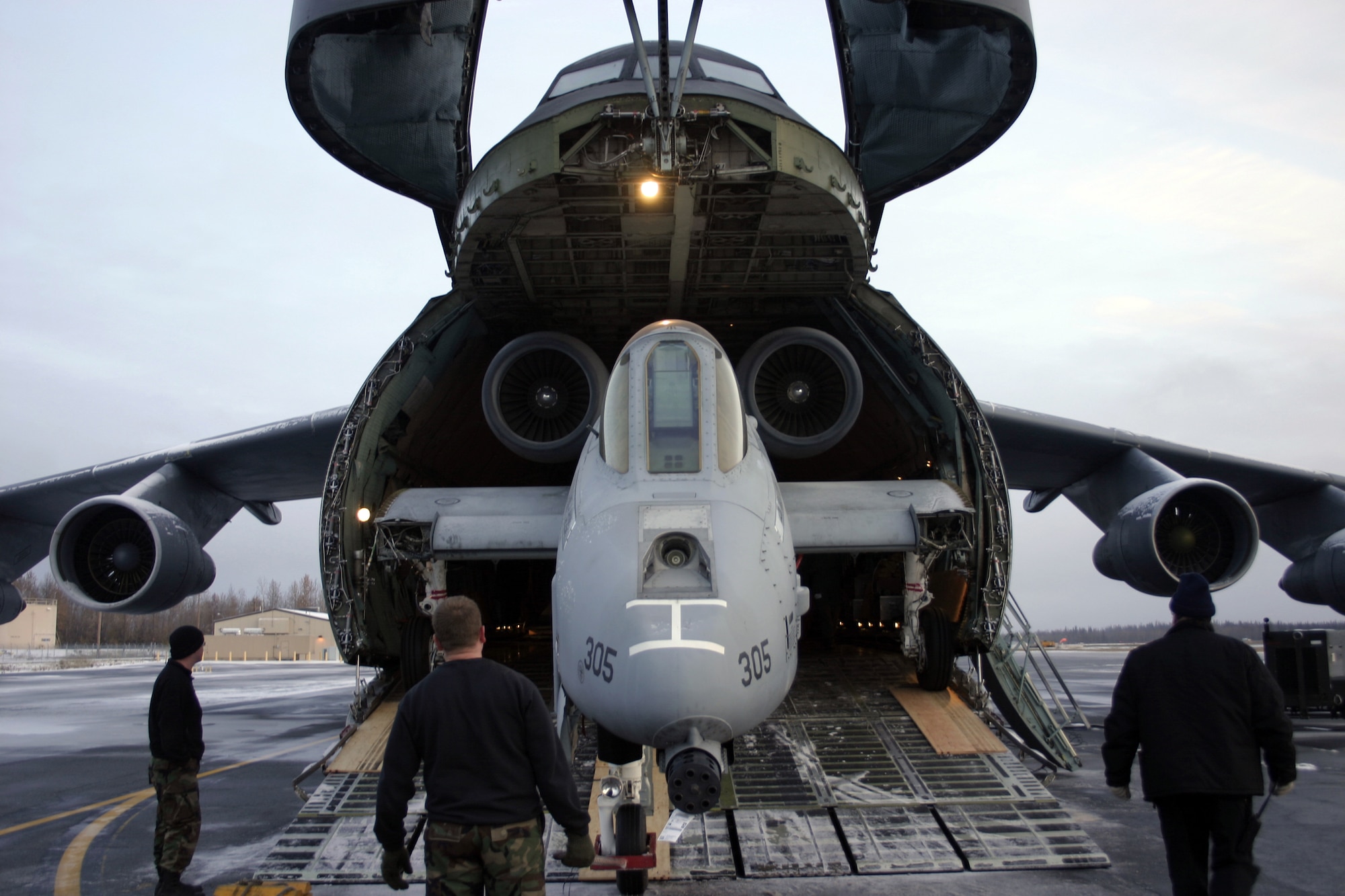 EIELSON AIR FORCE BASE, Alaska--The A-10 being winched back in the C-5 for transport to the Robbins AFB, Ga., Museum of Aviation Flight and Technology Center Oct. 6 on the flightline. The aircraft was disassembled into six different sections, which took a team of eight only three days to accomplish. (U.S. Air Force photo by Staff Sgt. Brian Hibbert)