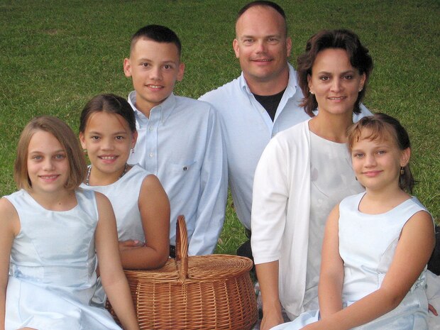 Maj. Evan East, 437th Airlift Wing, deputy director for AFSO 21, and his wife, Cristina, their children (from left) Charleyna, 10, Caitlyn, 10, Eran, 12, and Corey, 9. (Courtesy photo)