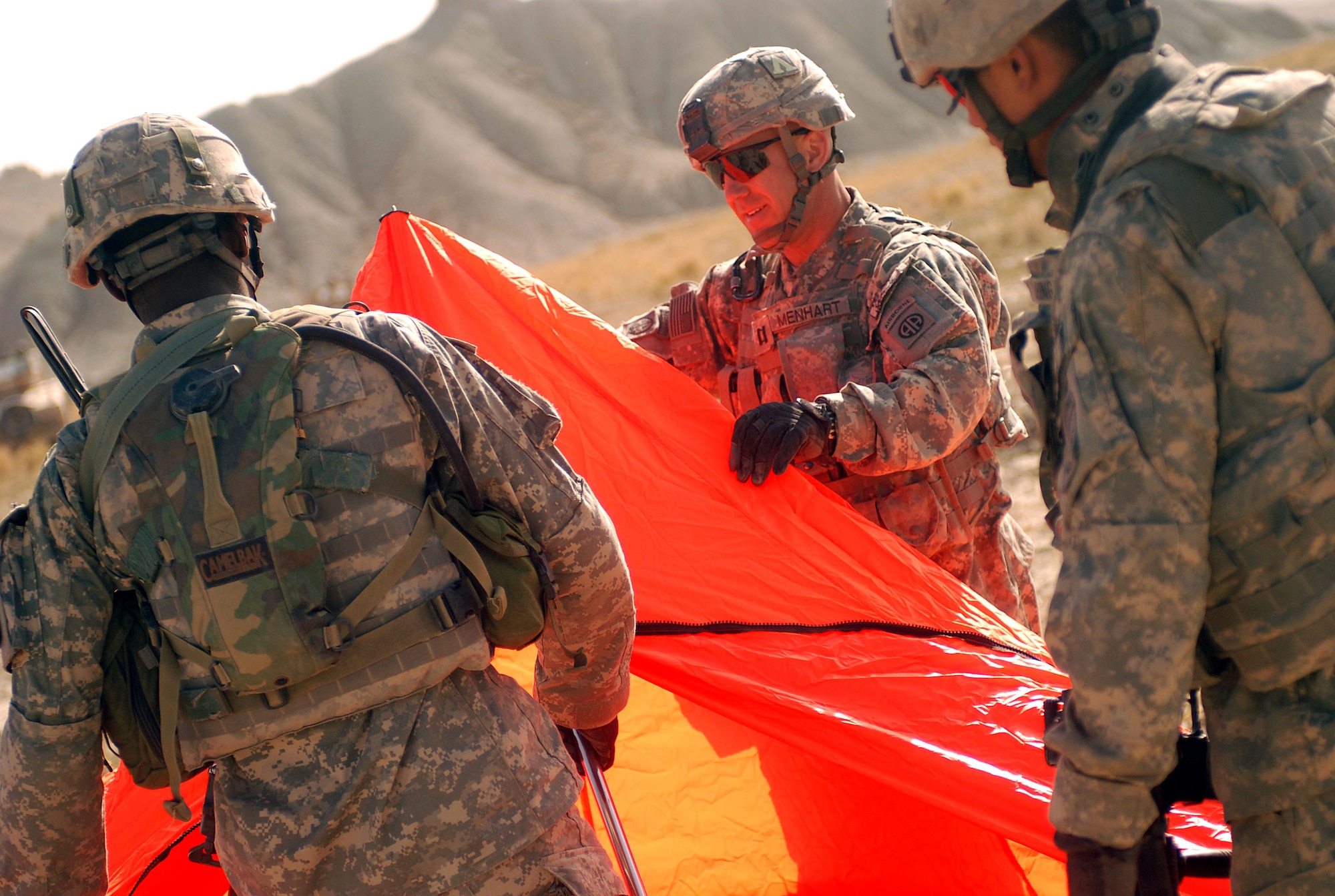 Paratroopers with the 782nd Brigade Support Battalion, 4th Brigade Combat Team, 82nd Airborne Division set up a raised angle marker on a drop zone in Paktika Province, Afghanistan, October 11. The RAM designates the intended point of impact for approaching C-17 Globemasters IIIs on an air supply drop mission. (U.S. Army photo/Spc. Micah E. Clare)