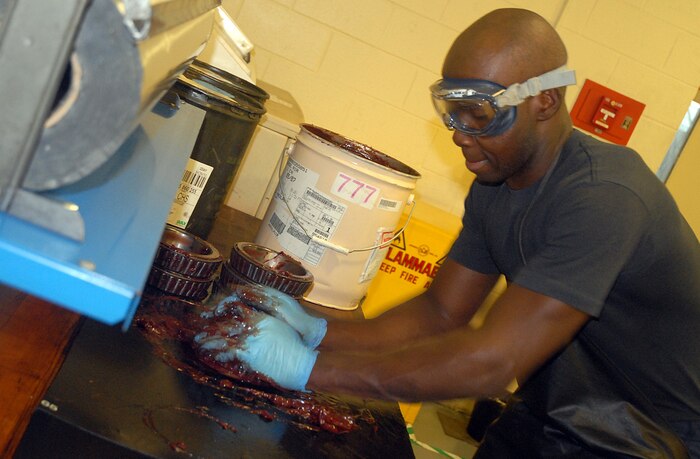 Senior Airman Ramon Brockington, 437th Maintenance Squadron C-17 crew chief, greases bearings for main landing gear wheels on a C-17 in the wheel and tire shop Wednesday. (U. S. Air Force photo/Airman Melissa White)