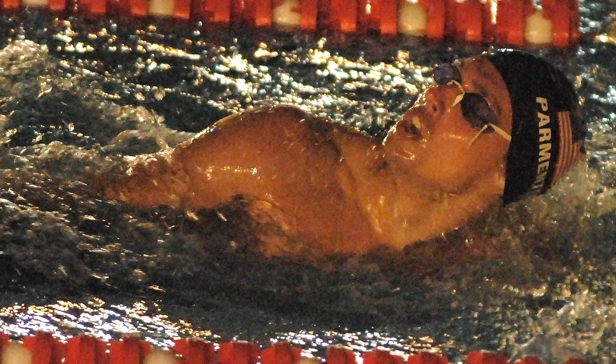 Second Lt. Paul Parmenter swims in the 200-meter individual medley race during the Military World Games competition Oct. 15 in Hyderabad, India. He placed fifth in the event. The Conseil Internationale du Sport Militaire's Military World Games event is the largest international military Olympic-style event in the world. In this year's fourth edition of the Games, 103 countries and more than 5,000 athletes are scheduled to compete Oct. 14 through 21 in boxing, diving, soccer, handball, judo, military pentathlon, parachuting, sailing, shooting, swimming, volleyball and track and field. The purpose of the Military World Games is to promote friendship through sport.(U.S. Air Force photo/Tech. Sgt. Cecilio Ricardo Jr.) 
