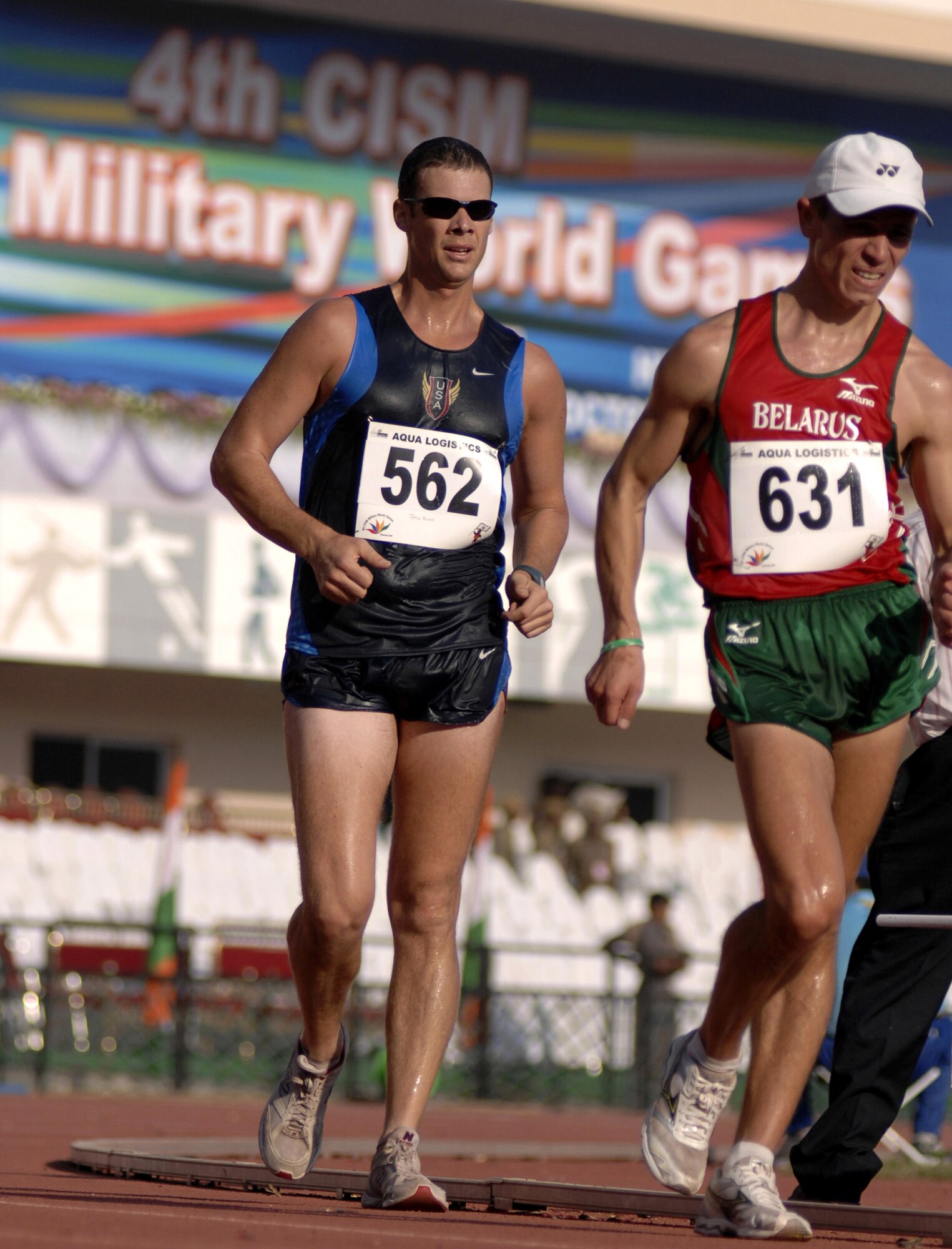 Army Sgt. John Nunn (left) speed walks during the Military World Games competition Oct. 15 in Hyderabad, India. He placed ninth in the event. The Conseil Internationale du Sport Militaire's Military World Games event is the largest international military Olympic-style event in the world. In this year's fourth edition of the Games, 103 countries and more than 5,000 athletes are scheduled to compete Oct. 14 through 21 in boxing, diving, soccer, handball, judo, military pentathlon, parachuting, sailing, shooting, swimming, volleyball and track and field. The purpose of the Military World Games is to promote friendship through sport. (U.S. Air Force photo/Tech. Sgt. Cecilio Ricardo Jr.)
