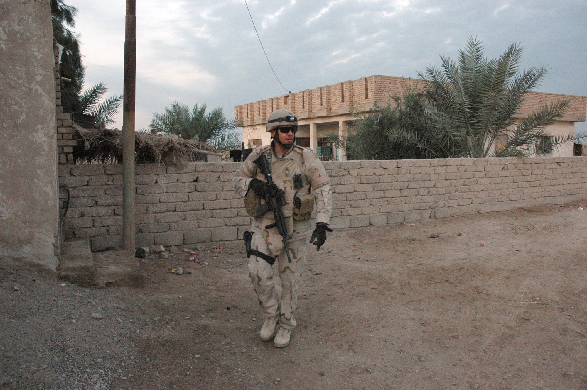 Then-Tech. Sgt. David Larriva patrols for bombs and unexploded ordnance in Baqubah, Iraq, during his deployment in support of Operation Iraqi Freedom. Master Sgt. David Larriva, 95th Civil Engineering and Transportation Directorate Explosive Ordnance Division chief, received a Bronze Star Medal during an award ceremony here Oct. 9. (Courtesy photo)