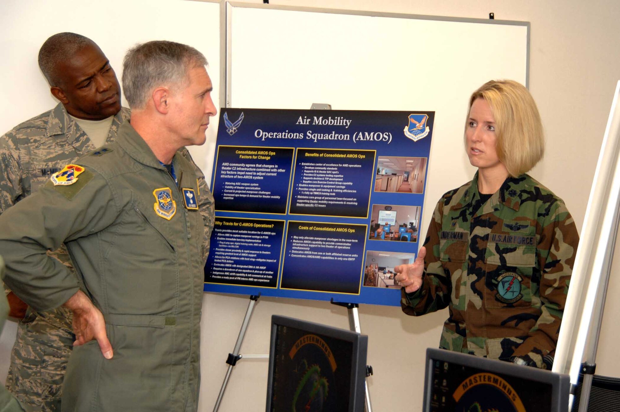 Lt. Col. Laura Lenderman, 15th Air Mobility Operations Squadron commander, briefs Maj. Gen. James Hawkins, 18th Air Force commander, and Chief Master Sgt. Brye McMillon, 18th Air Force command chief, on the 15th AMOS’ mission and proposed organizational changes during General Hawkins’ recent visit to Travis. (U.S. Air Force photo/Nan Wylie)


