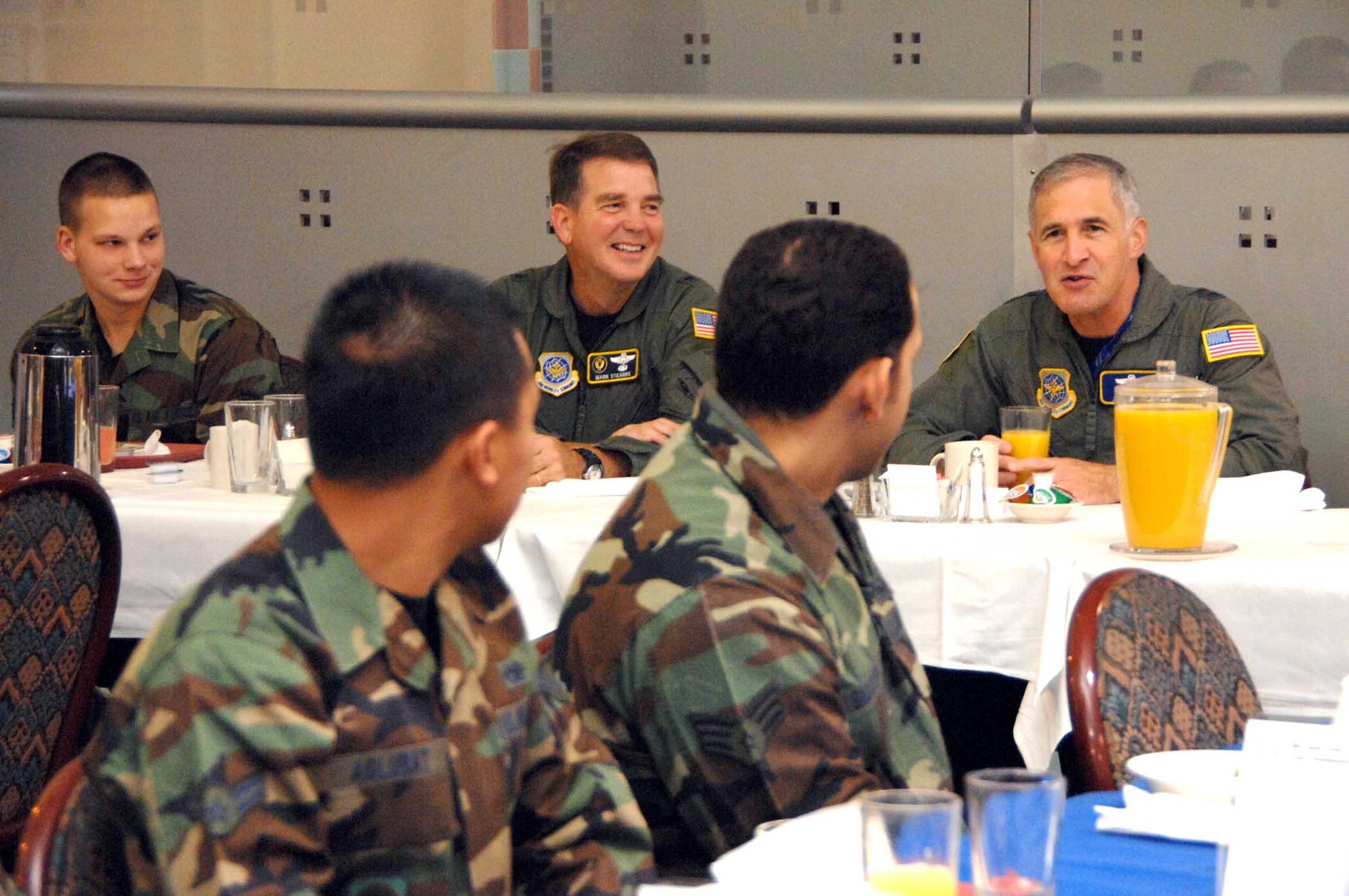 Left to right: Airman 1st Class Anthony Devaughn, 573rd Global Support Squadron, Brig. Gen. Mark Stearns, 15th Expeditionary Mobility Task Force commander, Maj. Gen. James Hawkins, 18th Air Force commander, and Airmen from the 615 Contingency Response Wing enjoy breakfast at the Sierra Inn Dining Facility during General Hawkins’ recent visit to Travis. (U.S. Air Force photo/Nan Wylie)