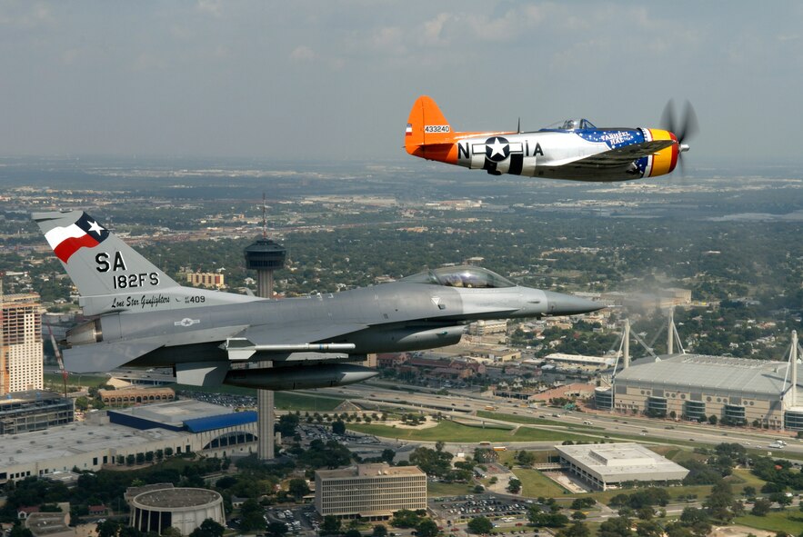 A vintage P-47 Thunderbolt and an F-16 Fighting Falcon perform a heritage flight together over San Antonio Oct. 11 as part of the 182nd Fighter Squadron's 60th anniversary celebration. The squadron, which belongs to the Texas Air National Guard 149th Fighter Wing, traces its heritage to the 396th Fighter Squadron, which flew P-47s in combat during World War II. For the Oct. 11 flight, Robbie Vajdos, of Louise, Texas, flew the P-47 from the Lone Star Flight Museum, in Galveston, Texas. Lt. Col. John Kane of the 182nd FS piloted the F-16. (U.S. Air Force photo by Senior Master Sgt. Mike Arellano)