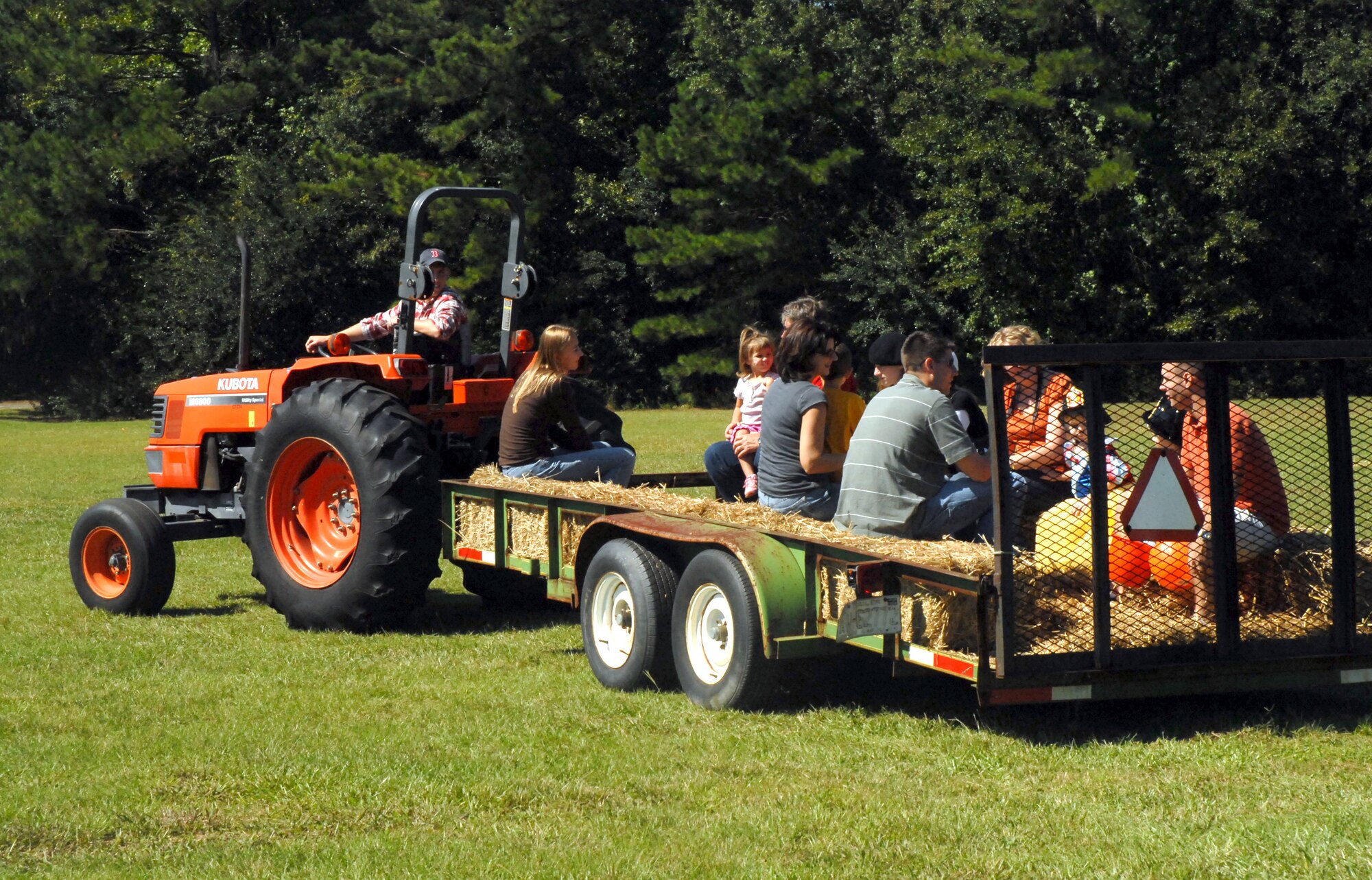 Family members from the 437th Operations Group enjoy a hayride at the base picnic grounds Saturday. (U. S. Air Force photo/Airman Melissa White)