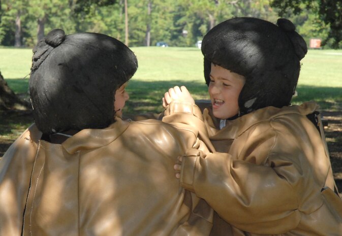 Brad DeThomas, 10, son of Lt. Col. Scott DeThomas, takes on Alex D'Antoni, 12, son of Lt. Col. Scott D'Antoni, during a sumo wrestling match during the fall fest. (U.S. Air Force photo/Airman Melissa White)