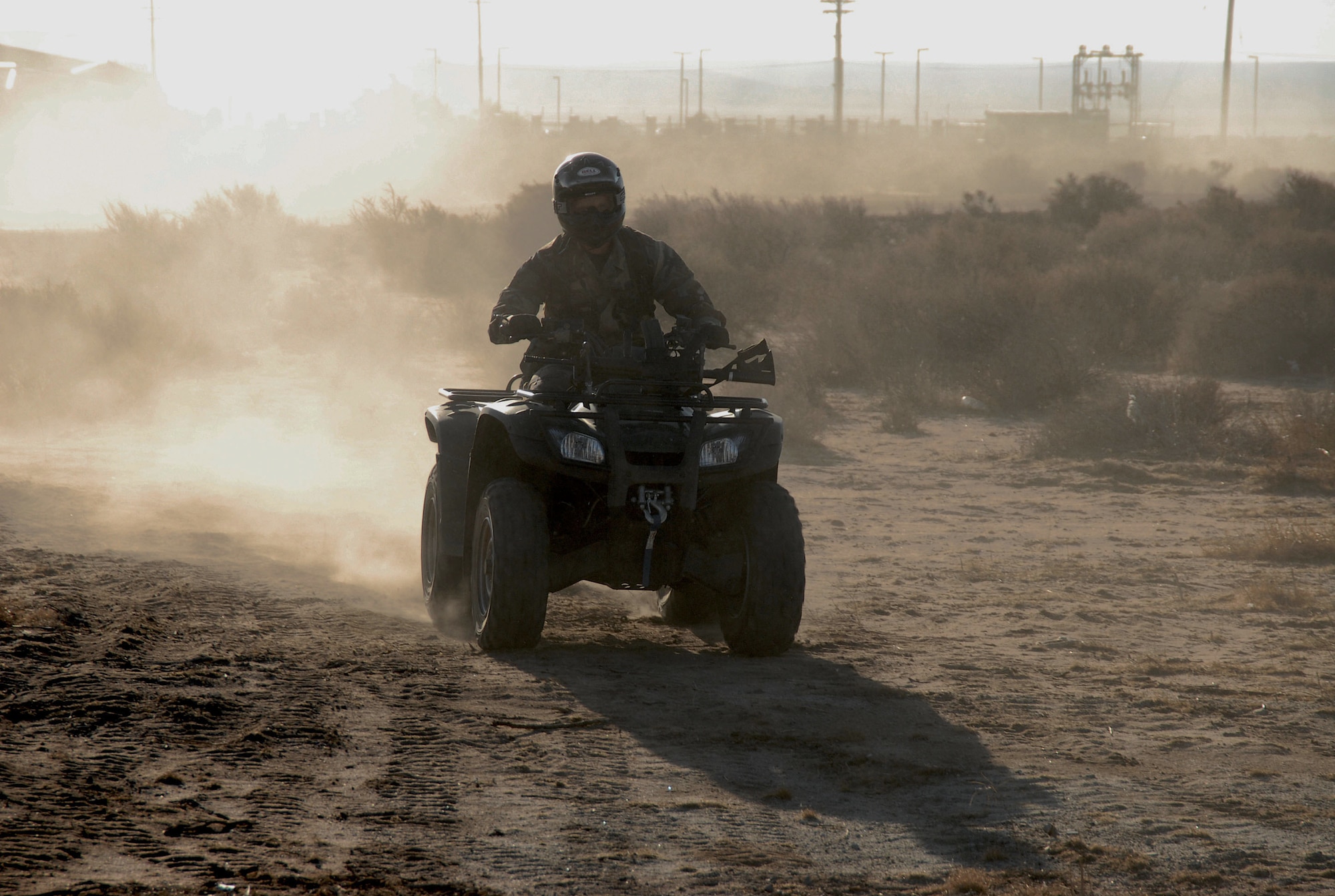 Senior Airman Jason Stephens, 95th Security Forces Squadron Wildlife and Animal Control, rides his all-terrain vehicle during the ATV instructor training course held here Oct. 9. To become an ATV instructor, individuals must attend a 40-hour training course, which consists of classroom, ATV riding skills and instructional training. Through the certification, instructors are able to train more riders on the use of ATVs to patrol the Edwards perimeter. (Photo by Senior Airman Jason Hernandez)
