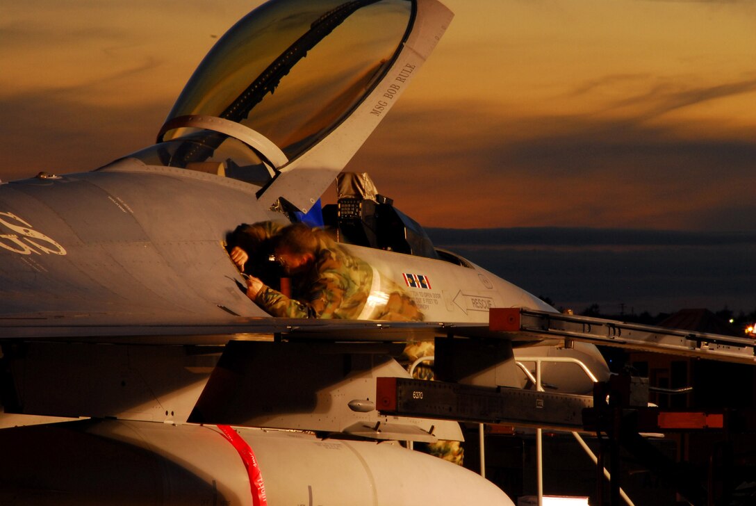 A 148th Fighter Wing Airman makes repairs to an F-16 Fighting Falcon during an Operational Readiness Inspection Oct. 13 at the Minnesota Air National Guard Base located in Duluth, Minn. The ORI is designed to evaluate the wing's ability to prepare and deploy servicemembers, equipment and support assets to a combat environment. (U.S. Air Force photo/Senior Airman Donald Acton)