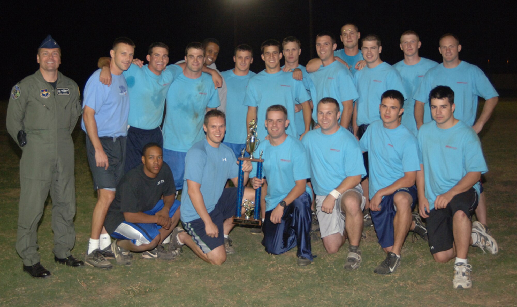 The 14th Operations Support Squadron #1 intramural flag football team poses with their first place trophy after the championship game Oct. 11. The 14th OSS defeated the 14th Medical Group team. They are pictured here with Col. Eric Thesien, 14th Operations Group commander. (U.S. Air Force photo by Airman 1st Class Danielle Powell)
