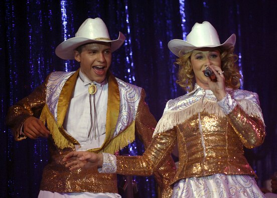 Senior Airman Jonathan Hayden and Tech. Sgt. Jennifer Dack of Tops in Blue perform for more than 200 Team Incirlik members in Hangar 4 Oct. 14 during the 2007 Tops in Blue World Tour. The theme of this year?s tour was a musical tribute to the 60 years of proud Air Force history. (U.S. Air Force photo by Airman 1st Class Nathan Lipscomb)