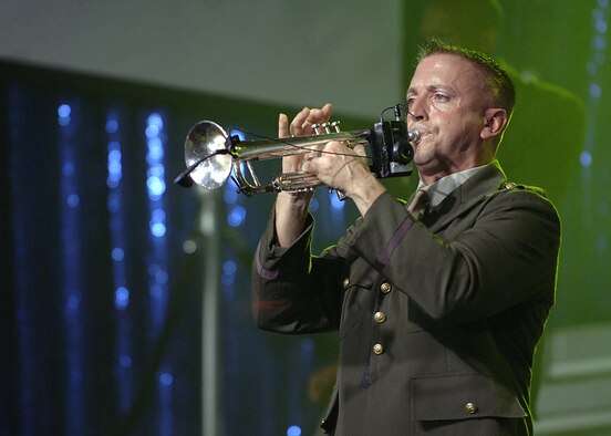 Tech. Sgt. Joseph Diaz, Tops in Blue trumpet player, belts out the brassy tones the big band era was known for. The members of Tops in Blue commemorated six decades of Air Force accomplishments with song and dance during their performance in Hangar 4, Oct. 14. (U. S. Air Force photo by Airman 1st Class Nathan Lipscomb) 