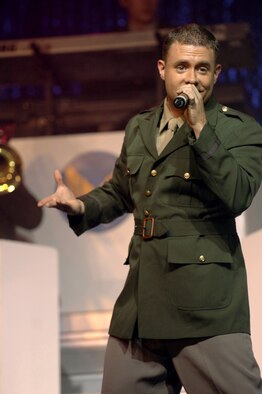 Senior Airman Nicolas Amari, Tops in Blue vocalist, sings for a crowd of more than 200 Team Incirlik members during their show in Hangar 4, Oct. 14. Tops in Blue travel wherever our U.S. Airmen are stationed to build the morale of those they perform for. (U. S. Air Force photo by Airman 1st Class Nathan Lipscomb) 