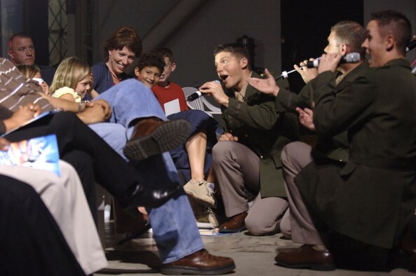 Members of Tops in Blue serenade Nikki Stefanek, daughter of Col. Ken Stefanek, 39th  Air Base Wing vice commander, in Hangar 4 Oct. 14 during their 2007 World Tour. Tops in Blue have more than 80 performances planned for 2007 paying tribute to 60 years of proud Air Force history. (U. S. Air Force photo by Airman 1st Class Nathan Lipscomb