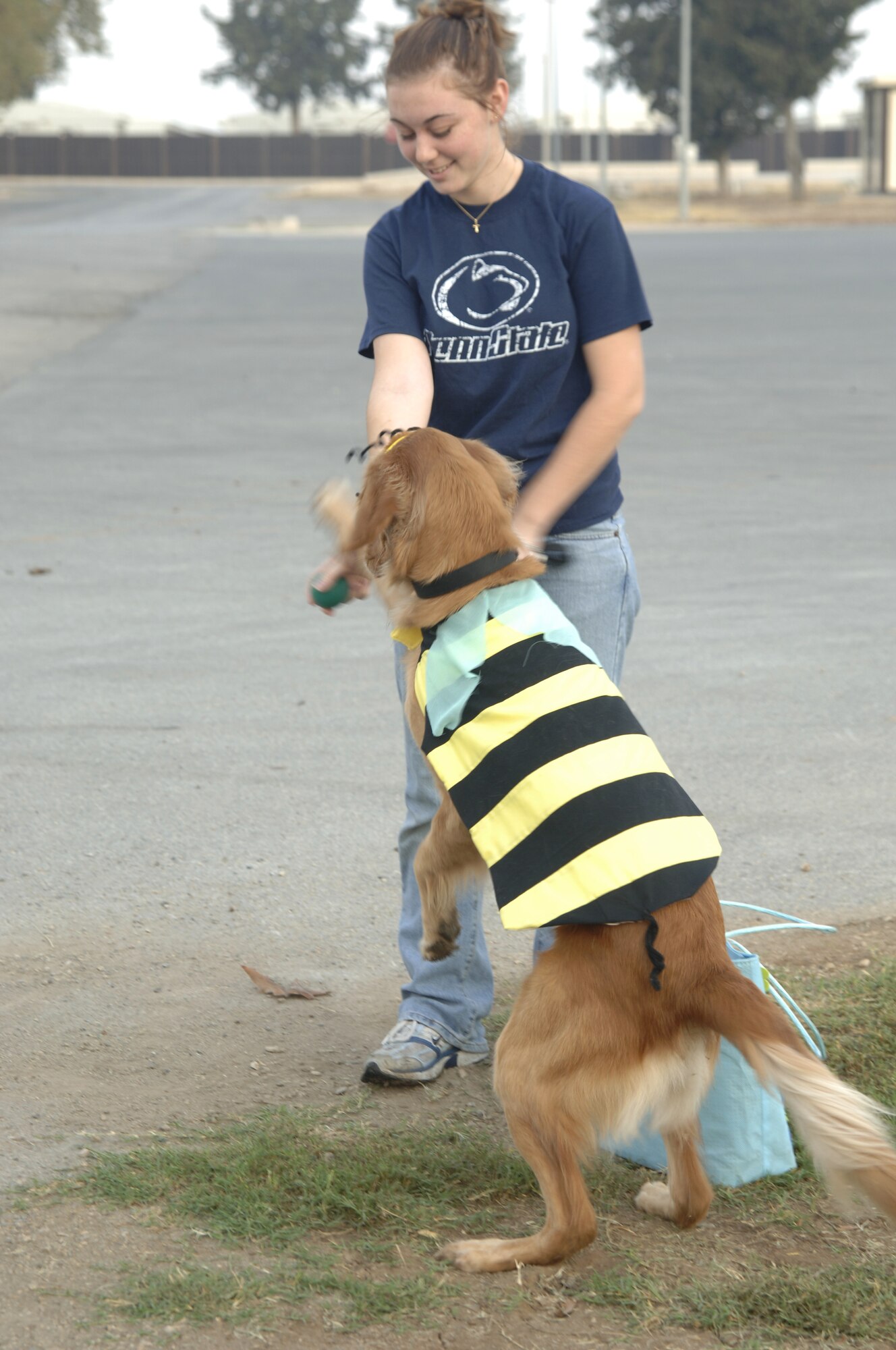 Cameron Coyle, Incirlik Vet Clinic assistant, gives her dog Brooke a treat Oct. 13 during the second annual dog costume contest at Arkadas Park. With more than 15 dogs participating it was tough competition for the four prizes that were given away; cutest, funniest, scariest and most original costume. (U.S. Air Force photo by Senior Airman Tiffany Colburn).