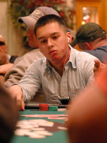 KUNSAN AIR BASE, South Korea - Airman 1st Class Kyle Petro, 8th Operations Group computer system administrator, contemplates his next play during the Texas Hold 'Em tournament here Oct. 16.  The 8th Services Squadron is holding a series of qualifying rounds every other Tuesday evening for the next month to determine the Kunsan AB Texas Hold 'Em Champion.  The Kunsan Champion will win a position at the Texas Hold 'Em Championship Showdown in Honolulu, Hawaii Jan. 23-27 with free airfare and lodging.  (U.S. Air Force photo/Staff Sgt. Darcie L. Ibidapo)