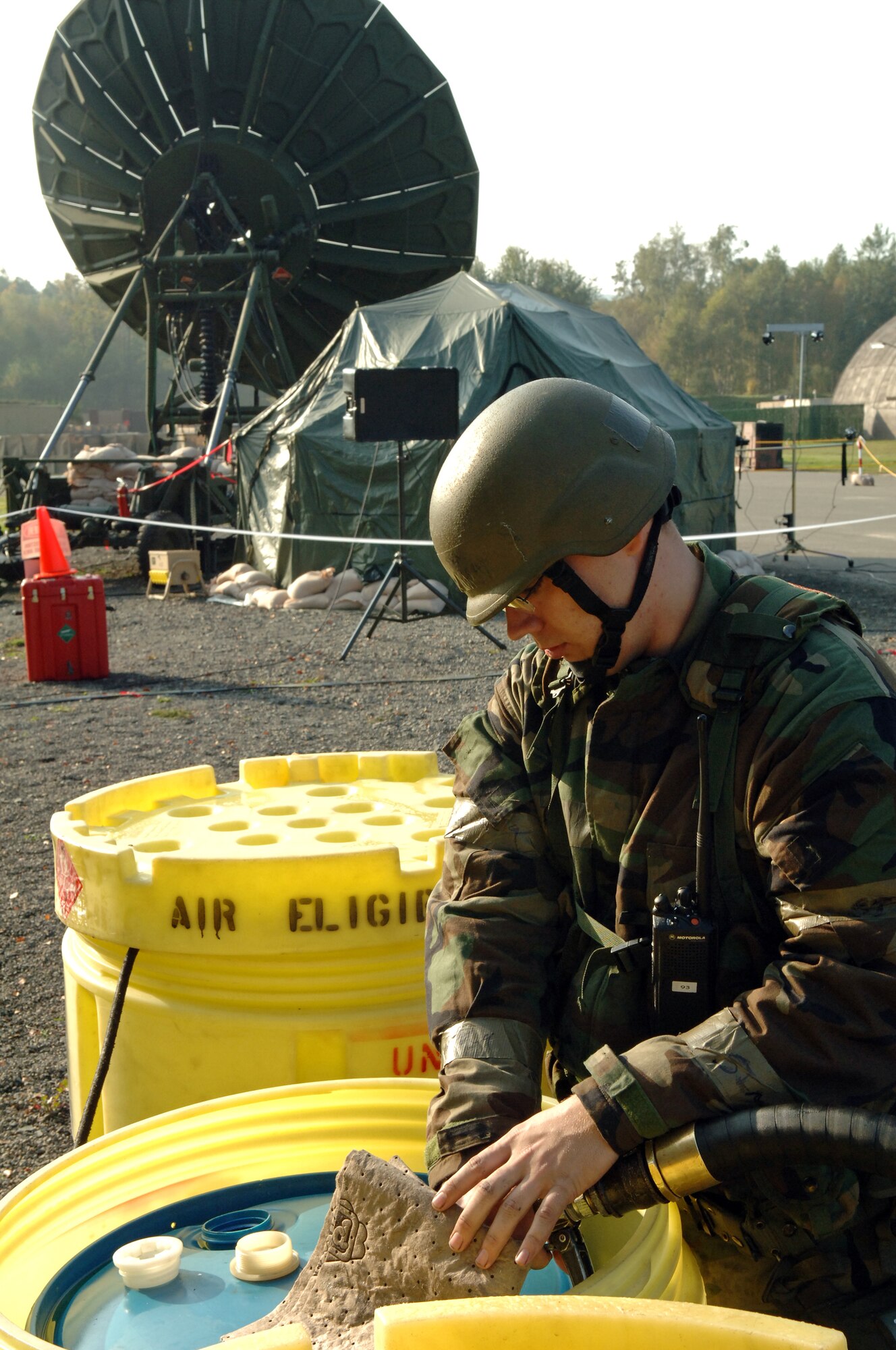 Senior Airman James Zoromski, 735th Civil Engineer Squadron power production technician, refuels the secondary fuel supply for a MEP-805 generator with diesel fuel during the Operation Readiness Exercise at the Field Training Site on Ramstein Air Base, Germany, Oct. 16. The exercise is designed to test the ability of Airmen to survive in austere environments with chemical, biological, radiological, nuclear and explosive hazards. (U.S. Air Force photo/Airman 1st Class Marc I. Lane)(RELEASED)