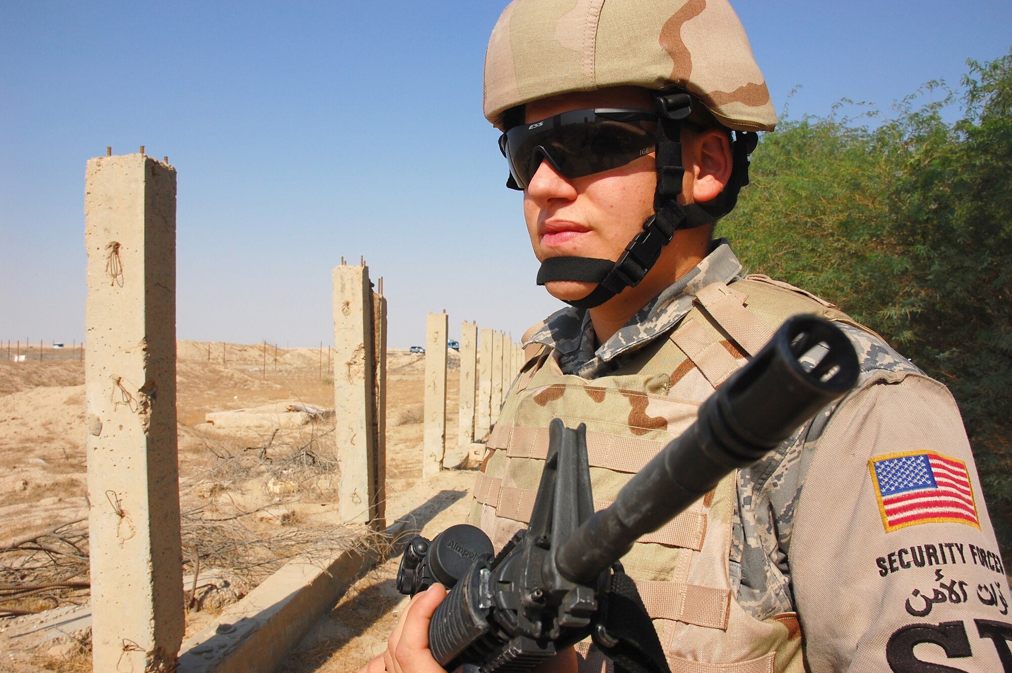 SOUTHWEST ASIA -- Airman 1st Class Christopher Michaud, 386th Expeditionary Security Forces Squadron elite entry controller, performs a security operations check at the base entry control point here Oct. 15.  Airman Michaud is from Titusville, Fla., and is deployed from Eglin Air Force Base, Fla.  (U.S. Air Force photo by Staff Sgt. Tia Schroeder)