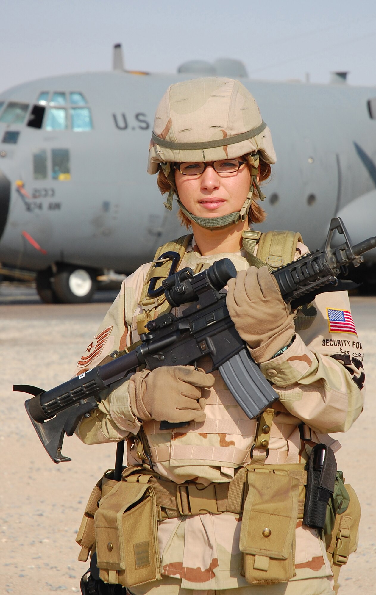 SOUTHWEST ASIA -- Tech. Sgt. Rebecca Pash, 386th Expeditionary Security Forces Squadron plans and programs, performs a security operations check of the flightline here Oct. 13.  Sergeant Pash is deployed from Eglin Air Force Base, Fla.  (U.S. Air Force photo by Staff Sgt. Tia Schroeder)