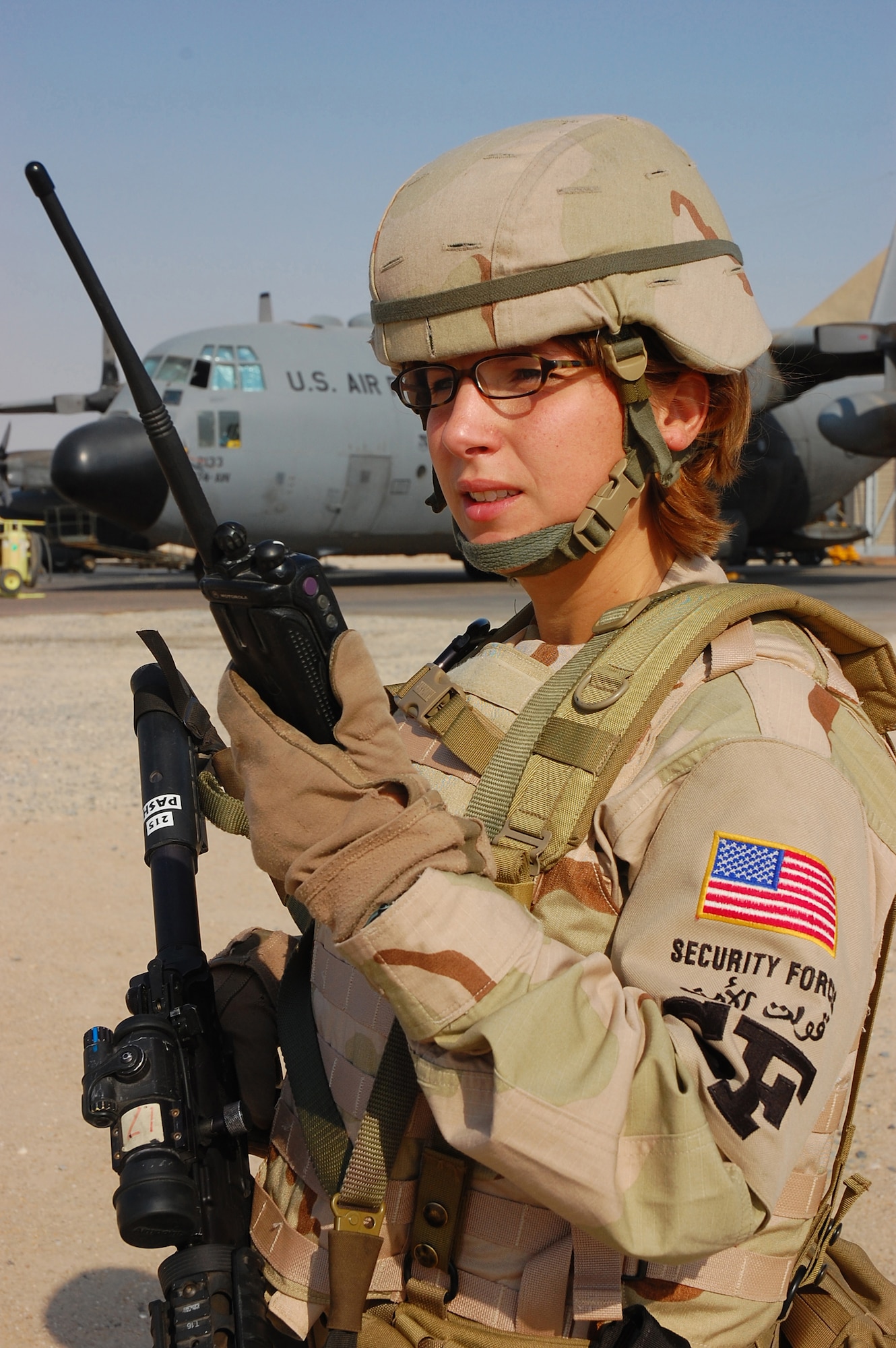 SOUTHWEST ASIA -- Tech. Sgt. Rebecca Pash, 386th Expeditionary Security Forces Squadron plans and programs, performs a security operations check of the flightline here Oct. 13.  Sergeant Pash is deployed from Eglin Air Force Base, Fla.  (U.S. Air Force photo by Staff Sgt. Tia Schroeder)