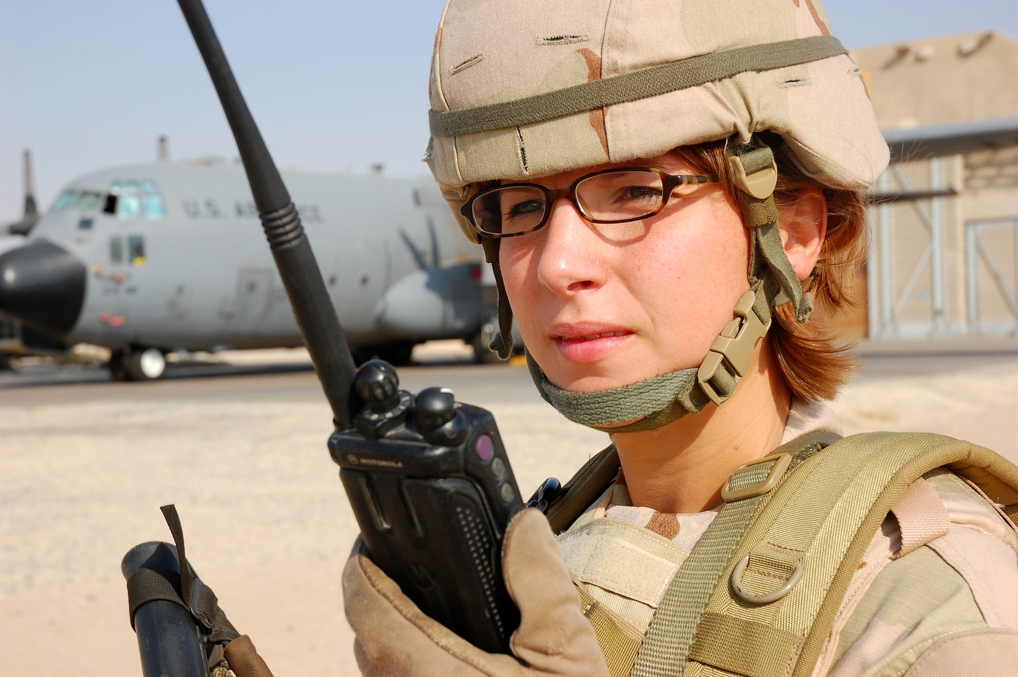 SOUTHWEST ASIA -- Tech. Sgt. Rebecca Pash, 386th Expeditionary Security Forces Squadron plans and programs, performs a security operations check of the flightline here Oct. 13.  Sergeant Pash is deployed from Eglin Air Force Base, Fla.  (U.S. Air Force photo by Staff Sgt. Tia Schroeder) 