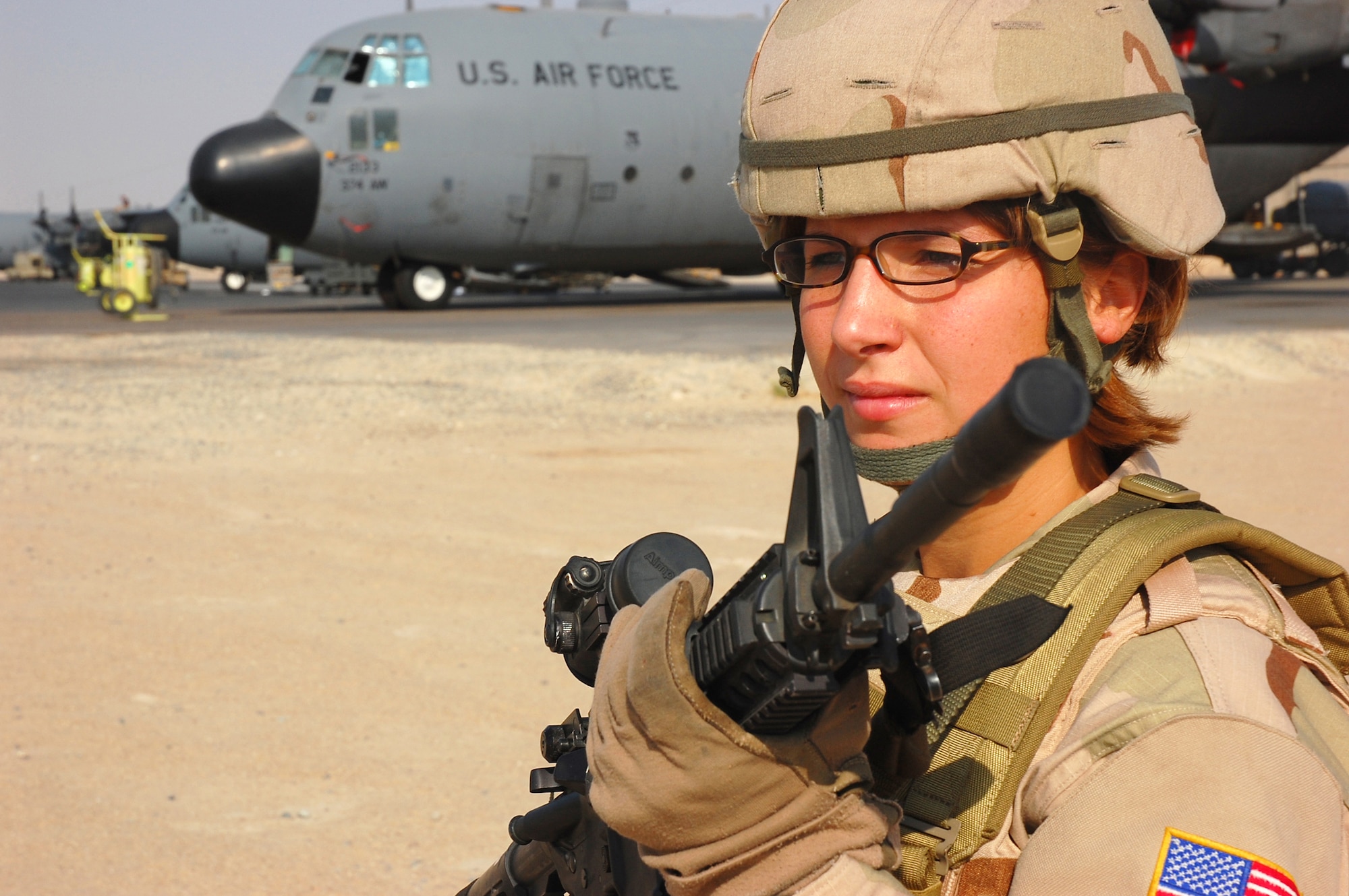 SOUTHWEST ASIA -- Tech. Sgt. Rebecca Pash, 386th Expeditionary Security Forces Squadron plans and programs, performs a security operations check of the flightline here Oct. 13.  Sergeant Pash is deployed from Eglin Air Force Base, Fla.  (U.S. Air Force photo by Staff Sgt. Tia Schroeder) 