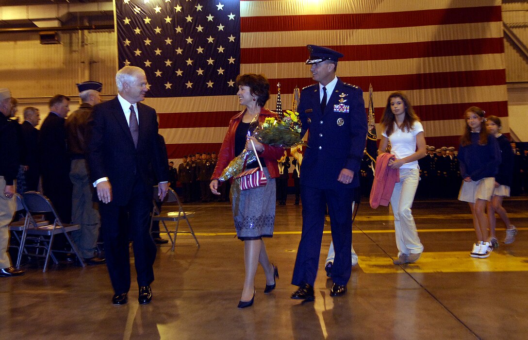 Defense Secretary Robert M. Gates walks with Air Force Gen. Kevin Chilton and his family after the general assumed command of U.S. Strategic Command during a ceremony at Offutt Air Force Base, Neb., Oct. 17, 2007.