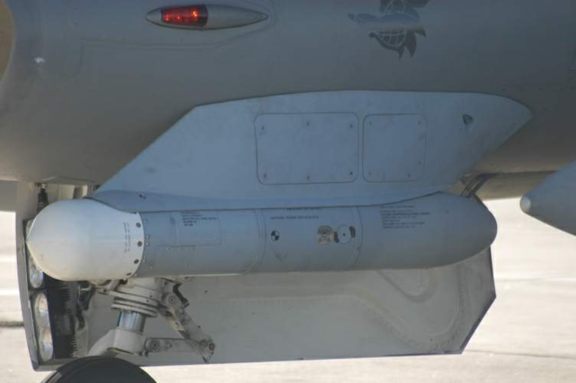 The High-speed Anti-Radiation Missile Targeting System, or HTS, loaded on the F-16CJ Block 50/52 Fighting Falcon at Langley Air Force Base, Va. (Courtesy photo)