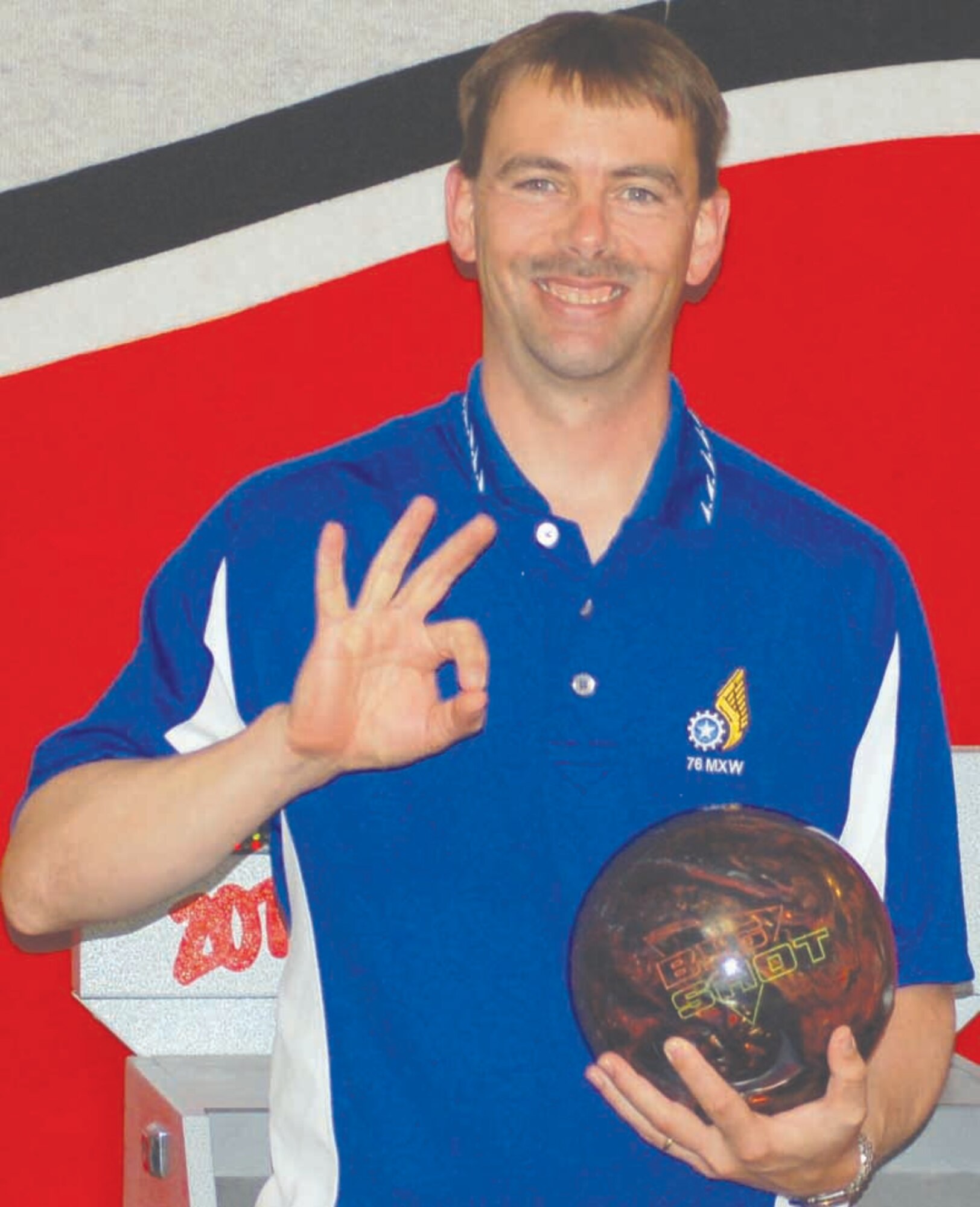 Christopher Sweet is all smiles after rolling a perfect game Oct. 10 at the Tinker Bowling Center. This was the fifth perfect game in the 76th Maintenance Wing worker’s career. (Air Force photo by John E. Banks)